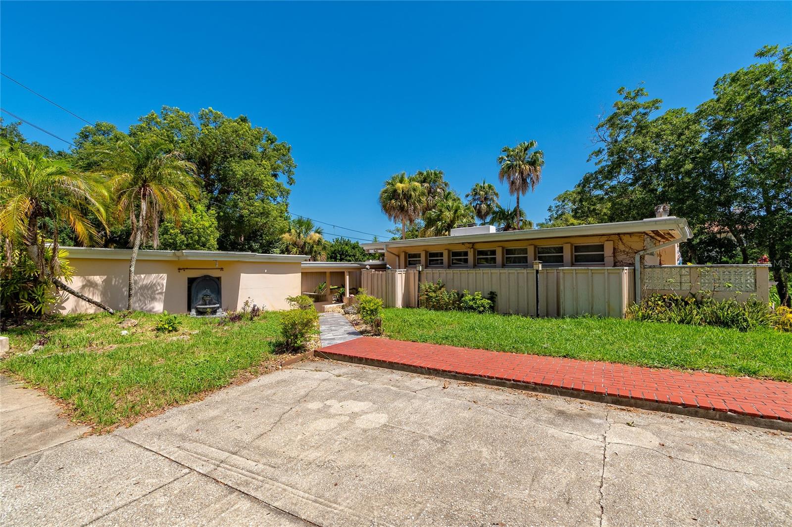 Opportunity awaits in the Beeman Park neighborhood, with access to the beautiful Lake Sue. This classic mid-century home features 3 bedrooms and 3 bathrooms spread across multiple levels, offering a unique layout with excellent potential for renovation, restoration, or complete reimagining.
The property requires repairs and updates, making it an ideal project for investors, contractors, or buyers looking to add significant value in this desirable location. Surrounded by mature trees, the backyard includes a peaceful creek along the rear property line, along with multiple decks and winding pathways that could be transformed into an exceptional outdoor retreat with landscaping improvements.
Properties in Beeman Park are rarely available, and the combination of location, architectural charm, and renovation potential makes this an outstanding investment opportunity. Whether your vision is to achieve a profitable resale, a long-term hold, or a future custom build, this property offers the chance to capitalize on one of Orlando's most established neighborhoods just minutes from Downtown Orlando, Winter Park, Baldwin Park, and the area's premier shopping, dining, and entertainment options. Bring your contractor, your imagination, and your plans; this is the sign you've been waiting for!