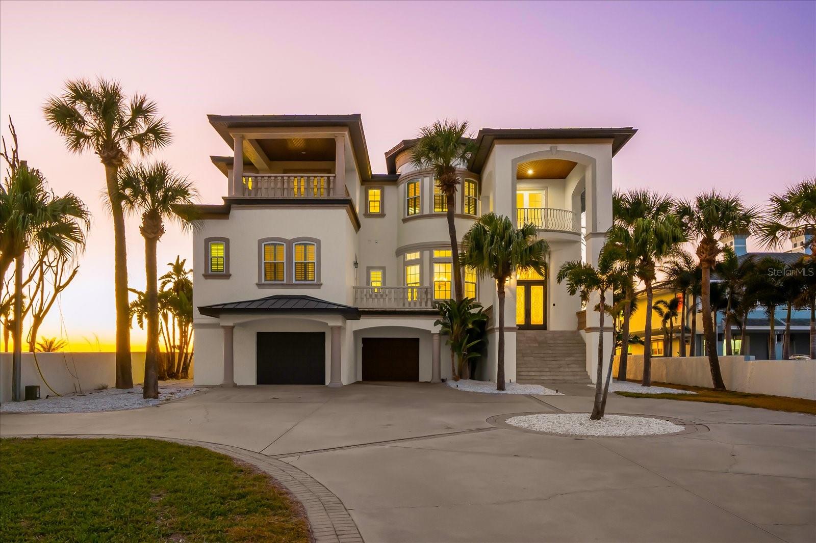 Perfectly positioned on 80 feet of direct Gulf frontage in the exclusive enclave of Belleair Beach, this extraordinary three-story coastal estate offers 7,528 square feet of refined beachfront living on an expansive 0.44-acre lot. Designed for both elevated entertaining and effortless everyday comfort, the residence showcases soaring ceilings, elegant crown molding, multiple gathering spaces with fireplaces, and seamless transitions to expansive Gulf-front balconies with sweeping panoramic water views. The chef’s kitchen is thoughtfully appointed with premium appliances—including a cooktop, range, refrigerator, freezer, and dual dishwashers—along with a high bar for casual dining and a fully equipped wet bar to enhance entertaining. The home features five spacious bedrooms, six full bathrooms, and two half baths, including a third-floor primary suite measuring approximately 21 by 18.5 feet, offering plush comfort and breathtaking Gulf vistas. Secondary bedrooms are generously sized with en-suite baths to ensure privacy for family and guests. A private elevator services all levels, while ceramic and quarry tile flooring in the main living areas is balanced by plush carpeting in the bedrooms. Additional highlights include a two-car attached garage, concrete seawall with uninterrupted water access, an aluminum standing seam roof (2025), impact windows and doors (2025), replaced A/C units (2025). With sugar-white sands just beyond your door and unobstructed Gulf views from nearly every vantage point, this estate presents a rare opportunity to own a legacy waterfront property where privacy, elegance, and coastal sophistication converge.