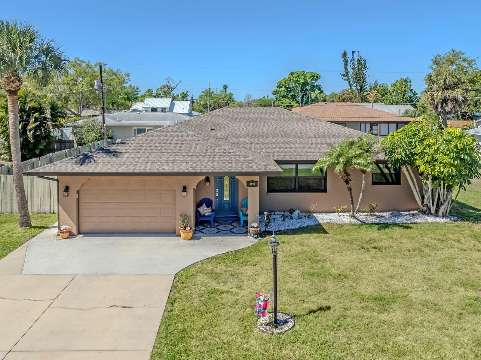 Great opportunity to own a MOVE-IN READY home at an exceptional value! Enjoy peaceful country living in this inviting 3-bedroom, 2 bath home featuring numerous major updates for worry-free ownership. Recent improvements include NEWER ROOF (2019), Newer A/C SYSTEM (2025) & ductwork, NEW HOT WATER HEATER (2026) and newly relined plumbing pipes, providing added comfort and peace of mind. The home offers a spacious great room design & open plan, ideal for both relaxing and entertaining. The Kitchen showcases custom solid wood cabinetry, with breakfast bar, newer appliances & upgraded bathrooms provide a modern feel. Tile flooring throughout the living area & laminate wood look in the bedrooms & fans in every room. A dedicated dining area adds to the home's comfortable layout. Step outside to your covered, under roof lanai and enjoy the privacy of a fully fenced yard - perfect for pets, outdoor activities, or simply unwinding in a serene setting. Home offers a Kenetico water system for purification. 220 hookups for electric car. Neighborhood is family & pet friendly. Residents have optional membership to access to the South Venice private beach, community boat ramp & Clubhouse. Non-required Flood insurance zone, no CCD and HOA fees. Whether you're looking for a vacation getaway, income producing investment, or full-time residence, this home offers flexibility, charm, and value all in one. Call now for your showing!