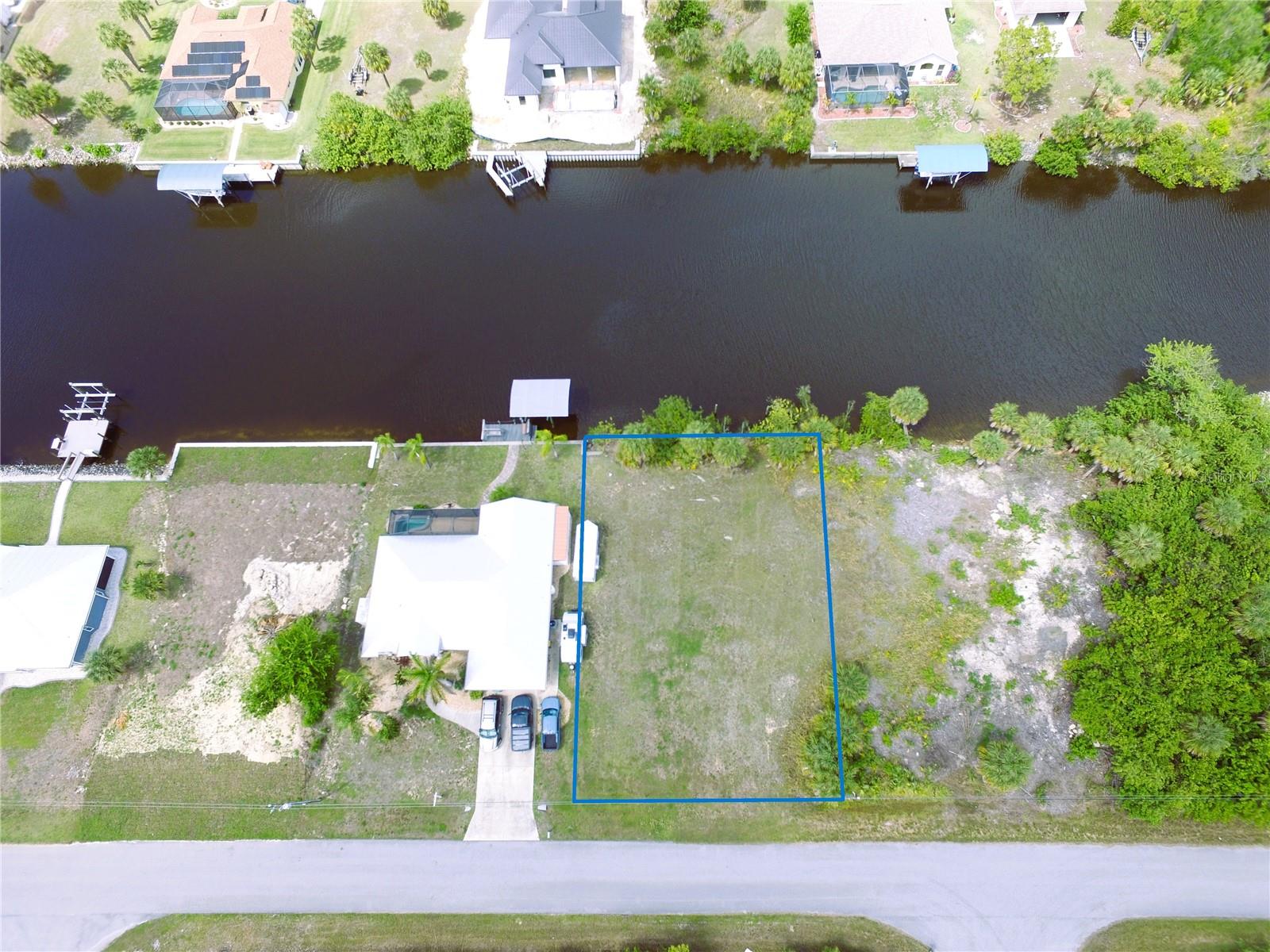 Build your dream waterfront house on this pristine 10,000-square-foot cleared lot, perfectly situated on a massive 150-foot-wide canal with no bridges and a short one-mile cruise to the Myakka River, offering effortless access to the Gulf. This level, ready-to-build homesite features 80 feet of riprap frontage has 4 good pilings for future dock and is located in a prime area just minutes from premium shopping and dining. Experience the best of the Florida lifestyle with multiple world-class Gulf beaches all within a 15 - 20 mile radius. Whether you are looking to dock a large vessel or simply enjoy expansive water views, this exceptional property offers the rare combination of deep-water access, convenience, and natural beauty. Don’t miss this opportunity to secure a slice of paradise in a rapidly growing community. Your coastal lifestyle starts here!