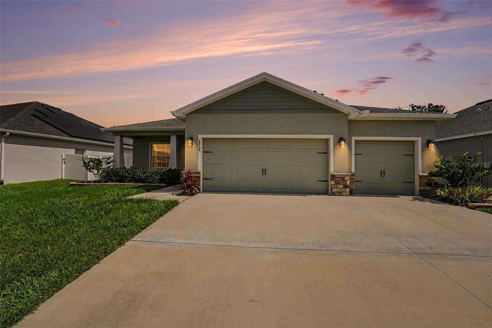 You will feel right at home stepping into effortless Florida living in this beautifully maintained 2023 built home, where modern design meets every day living. Thoughtfully loved and cared for since day one, this home feels practically brand new. With an open concept and split floor plan, it's the perfect home for quiet nights or easy entertaining. The kitchen is designed to be to be the heart of the home, with modern cabinetry. This home also includes upgraded high-speed internet wiring throughout, providing fast and reliable connections for streaming, working from home, gaming, and everyday use.
The living area is also pre-wired for surround sound, making it easy to create a clean, built-in home theater without the hassle of running speaker wires., and a layout that keeps everything within reach. There is luxury vinyl flooring through most of the home, with carpet in the three secondary bedrooms. It has an oversized three-car garage that has the wiring in place for a car charger.

The bedrooms are very comfortably sized offering flexibility for additional offices or flex rooms. Oh by the way, it has a designated flex room in addition to the four bedrooms. And that primary, it checks all the boxes. The primary bathroom has a walk-in closet that will leave you excited to shop even more after purchasing this home just so you can fill it up.

The outdoor area has a nice porch and private, fenced backyard to enjoy some sun, grilling, or just fresh air!

This home is conveniently located close to shopping, dining, major roadways, and still has that peaceful quiet home feeling. 

Call today for a personal tour of one of our favorite homes!