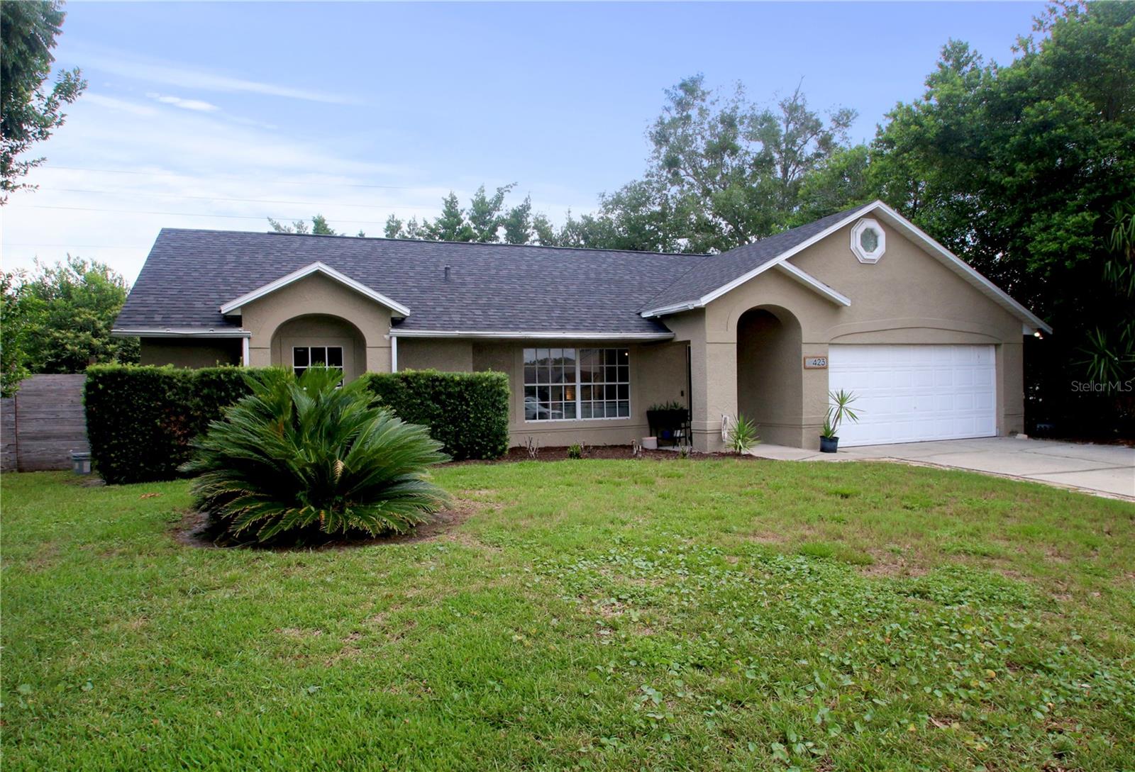 Stunning home with many upgrades in the highly sought-after Hills of Lake Mary. Three bedrooms, two baths and a 2-car garage. This home welcomes you with vaulted ceilings, a spacious split floor plan, and oversized rooms. This is a true custom kitchen boasting custom cabinets with plenty of storage and concrete counters. Stainless steel appliances feature a double oven and a cook top with hands free vent. Massive kitchen/dining combo is nearly 30 feet long and includes additional counter space for more storage and a dry bar. The island sets the tone with the concrete waterfall overlooking the large family room. The layout has been reconfigured to give it that modern and airy feel perfect for entertaining. Plenty of space for your king size bed in the primary bedroom with included en-suite and a redesigned walk-in closet with custom lighting. A few small projects remain which gives buyer an opportunity for a little sweat equity. Newer roof (2023) Replumbed (2024) HVAC (2019) Low HOA and no sewer bill. Call today for your personal tour.