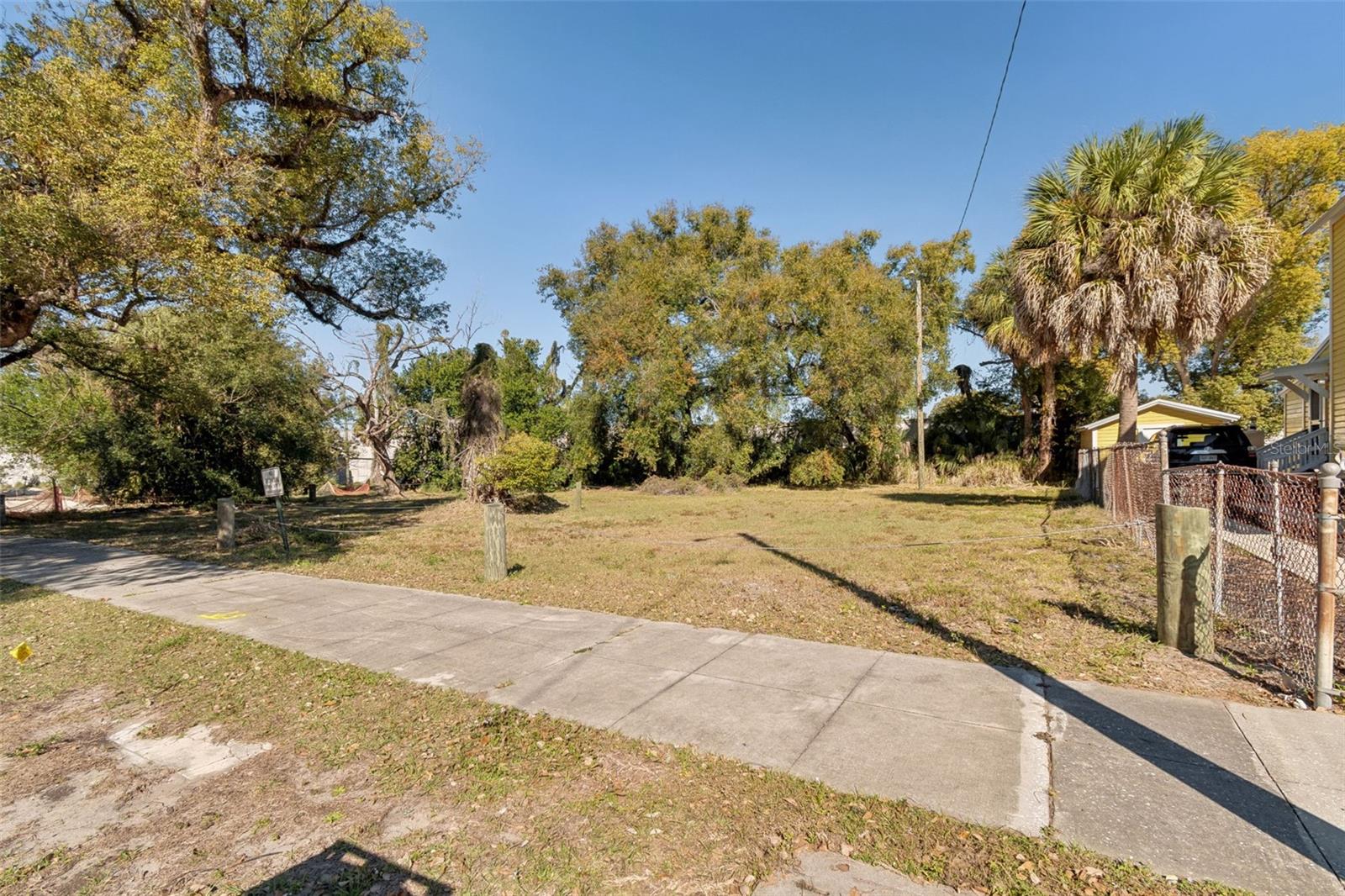 Prime vacant lot in the heart of Historic Ybor City! This approximately 2,500 sq. ft. property is located just 5 minutes from Downtown Tampa, only 10 minutes from Tampa International Airport, and a couple of blocks from iconic 7th Avenue. Enjoy the charm of mature trees, paved roads, and classic Ybor character throughout the neighborhood. The lot appears to have access to nearby utilities, offering strong potential for a quick and efficient build. Priced to sell, with neighboring parcels potentially remaining vacant for the foreseeable future based on current ownership. The adjacent lot is also available for purchase, providing an excellent opportunity to own additional land.
Listing is for land only. Buyer is responsible for independently verifying all information including, but not limited to, utilities, zoning, land use, restrictions, flood zone, and development requirements through the appropriate county or municipal offices. Buyers must conduct their own due diligence to confirm all facts and figures. If specific details are not included, the information is likely unavailable and should be confirmed directly with the county. Please ensure the property meets your intended use before submitting an offer. Excellent investment opportunity in one of Tampa's most vibrant and historic neighborhoods.