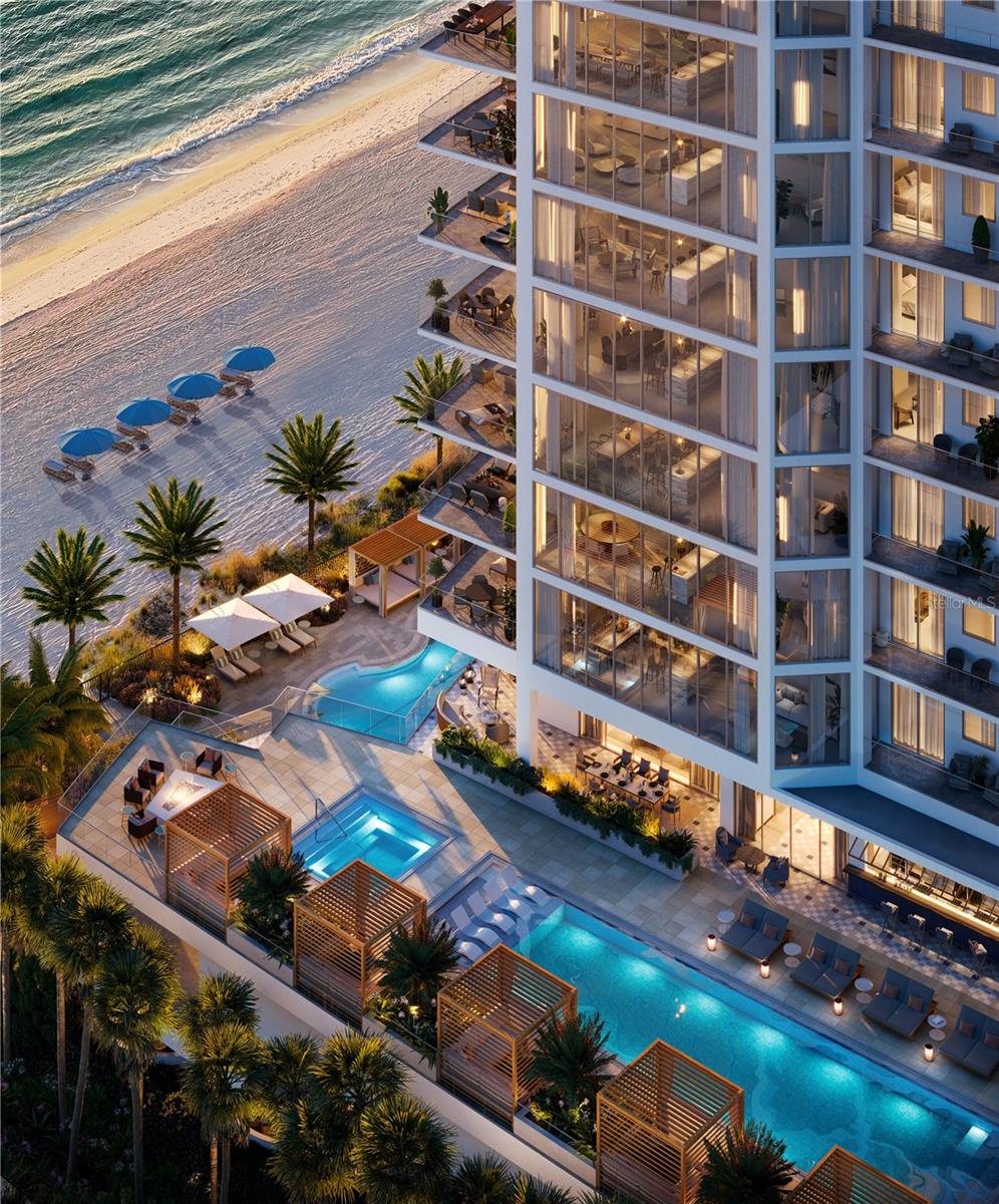 One or more photo(s) has been virtually staged. Under Construction. The Rosewood Residences, Lido Key is the first collaboration between Rosewood and a developer for a stand-alone residential condominium bearing the prestigious Rosewood name. Offering a limited collection of 65 stunning private residences located on 3.5 acres of one of the most treasured beaches on the West coast of Florida with 235 feet of beach frontage. The 11-story design by Miami based Swedroe Architecture with interiors spaces thoughtfully designed by Lillian Wu Studios of NYC. Offering 24-hour concierge, valet parking and bespoke owner services by Rosewood Resorts. Residence #707 features 11’ ceilings, 4 bedrooms, 4.5 baths plus den with 4,482 square feet perfect for entertaining. Dramatically organized around an expansive island and an inviting full wet bar along with views of the sunsets. As the private elevator doors open to the grand salon, the floor to ceiling windows provide a spectacular view of the Gulf of Mexico. Three guest ensuite bedrooms plus a spacious den ensuring owners and guests privacy. The Owner’s suite continues the views even further, with a full wall of floor to ceiling windows and glass door leading out to your expansive terrace. Imagine waking up to this view and enjoying a cup of coffee from the morning bar without having to leave your owner’s suite. No detail overlooked in the expansive kitchen with Wolf, Sub-Zero, Waterworks plumbing fixtures, Rocky Mountain hardware and Irpinia cabinets with a multitude of finish choices. Grab your favorite vintage from your Sub-Zero wine refrigerator as the chef in your life creates their masterpiece on the outdoor summer kitchen with built in gas grill. The residence is a perfect location for entertaining and offers a separate service galley with a second refrigerator, oven, and dishwasher, a perfect space for catering or a dinner prepared by your onsite chef and delivered by the in-residence dining team. The 46,900 square foot amenity level offers an intimate, private club atmosphere surrounded only by family and friends. The spaces are perfect for gathering or quiet escape. Only 65 owners, your experience will be as private as it will be luxurious. Lavish amenities include a private waterfront Bistro dining option, a world-class fitness center with options for private training and yoga, two outdoor pools, private cabanas, day beds, towels, food and beverage service. The wellness spa is a haven for relaxation with hot and cold plunge pools, sauna and steam rooms and private massage treatment rooms. The Club Lounge, serving morning coffee, is a wonderful place to start the day. The other amenities include an exciting game room with TVs, bar, billiards, jukebox and game tables, a nine-seat private theater and six generously sized guest suites allowing owners’ family and friends to enjoy the pleasures of this private resort. The 3rd level pool terrace offers a Zero-edge swimming lap pool & spa with sun shelf, day cabanas and social seating. Fire pit terraces, bocce lawn, Butterfly & chefs garden. The Beach club with a Zero-edge swimming pool with sun shelves and day cabanas, chairs, towel and umbrella service also includes an outdoor pursuits program including kayaking and standup paddle boards. Rosewood’s “Enriched Living” creating experiences that are authentic, original, and deeply personal by offering impeccable service and unparalleled attention to detail. Private enclosed garages included.