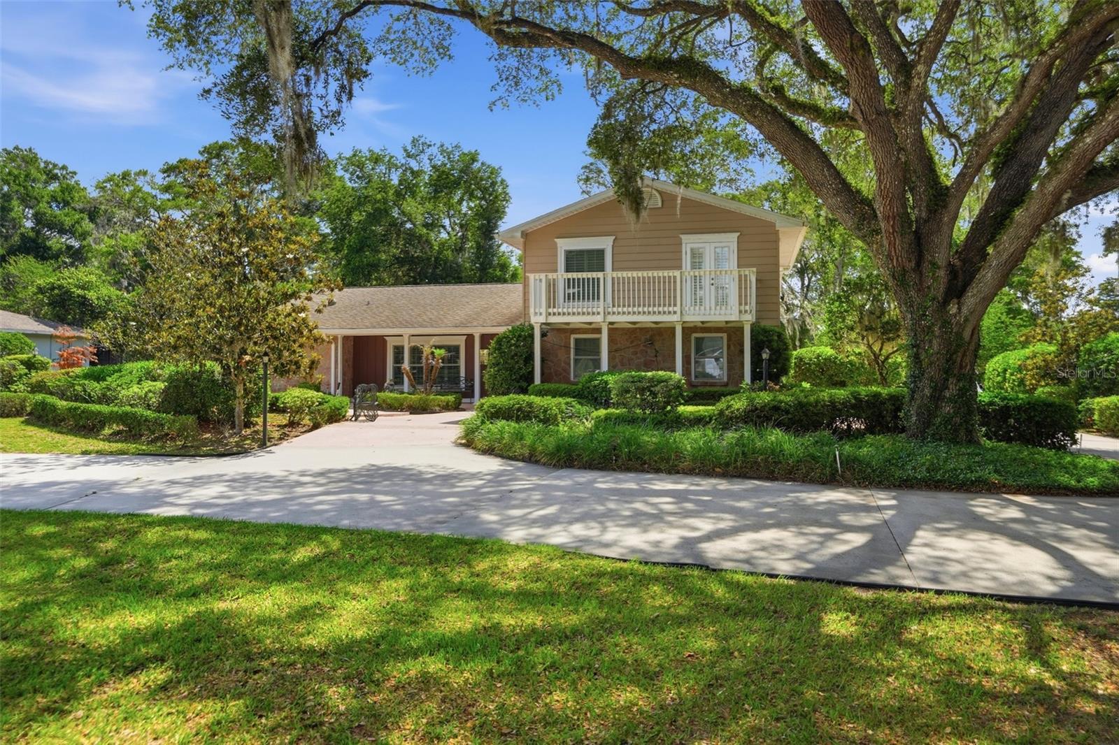 One or more photo(s) has been virtually staged. 10002 Domingo Dr, Brooksville, FL 34601 - Welcome to this beautifully maintained two-story home nestled on just over a half-acre in the highly sought-after community of Dogwood Estates. Featuring 4 bedrooms, 3 full baths.  Offering timeless charm and distinctive character, this residence blends the warmth and elegance of an old Victorian-style home with tasteful modern updates and meticulous care throughout.
Boasting 2,173 living square feet plus an additional 336-square-foot enclosed sunroom, this spacious home is designed for both comfortable everyday living and entertaining. From the moment you enter, you are greeted by a large formal living room or study that sets the tone for the home's inviting character and charm. The updated kitchen offers an abundance of counter space, ideal for gatherings and entertaining, while the adjoining sitting area creates the perfect setting for formal dining overlooking the pool area.
Beyond the foyer, the expansive family room showcases beautiful views of the pool and outdoor living space. Plantation shutters throughout the home add timeless elegance, while the combination of tile and wood flooring enhances the warm and inviting atmosphere. Crown molding throughout further elevates the interior with refined architectural detail.
The first-floor primary suite offers comfort and privacy, featuring a beautifully updated bath complete with a jetted soaking tub, separate shower, and spacious layout designed for relaxation. An additional first-floor guest bedroom and full bath provide excellent flexibility for guests or multigenerational living.
Upstairs, two private guest bedrooms share a full bath and each feature access to their own outdoor terrace, creating peaceful retreats with added privacy for family or visitors.
The enclosed sunroom features tile flooring and walls of windows overlooking the pool area, offering a bright and relaxing extension of the living space year-round.
Step outside and enjoy the beautifully landscaped park-like setting complete with a charming gazebo, spacious pavered pool area, and additional storage shed. The outdoor living space creates the perfect private retreat for relaxing, entertaining, or enjoying Florida living at its finest.
Outside, the oversized side-load two-car garage and expansive circular driveway provide ample parking and impressive curb appeal. This home has been meticulously maintained with major updates including a roof replaced in 2011, AC in 2012, and several windows updated in 2021.
If you are searching for a home filled with character, warmth, privacy, and timeless appeal in an established community, this exceptional Dogwood Estates property is truly one-of-a-kind.