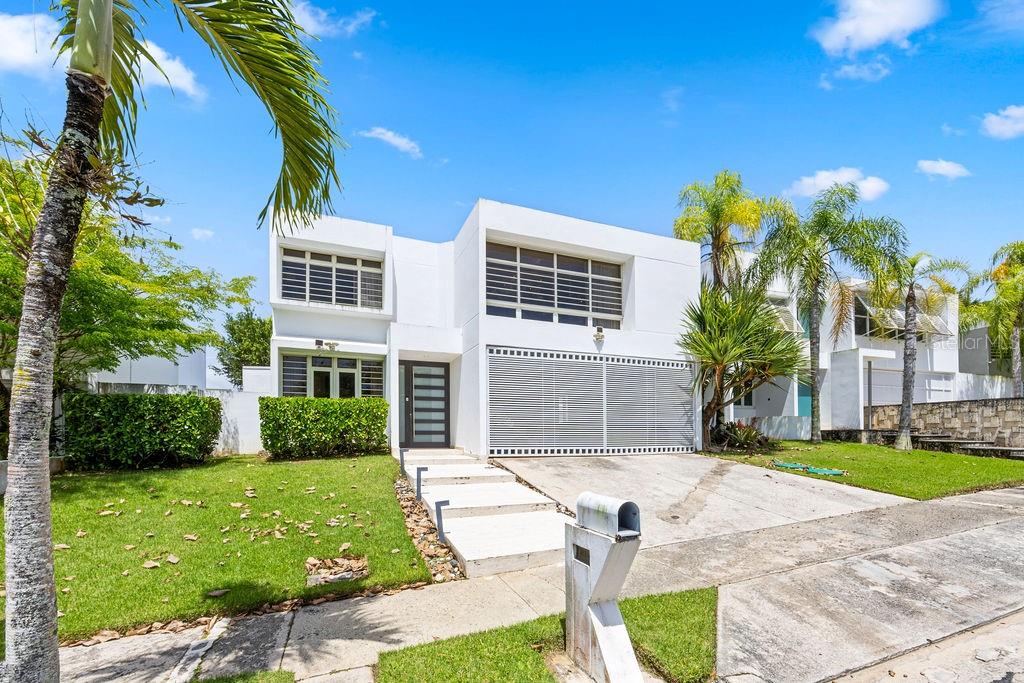 Spectacular fully remodeled residence featuring elegant marble floors, an expanded gourmet kitchen, custom wine cellar, heated saltwater pool, and spacious outdoor terrace. This private property is equipped with a full backup generator and water cistern for added comfort and peace of mind. Located within a secure community with 24/7 gated security, the home also boasts beautifully renovated bathrooms and exceptional attention to detail throughout. A perfect blend of luxury, comfort, and functionality.