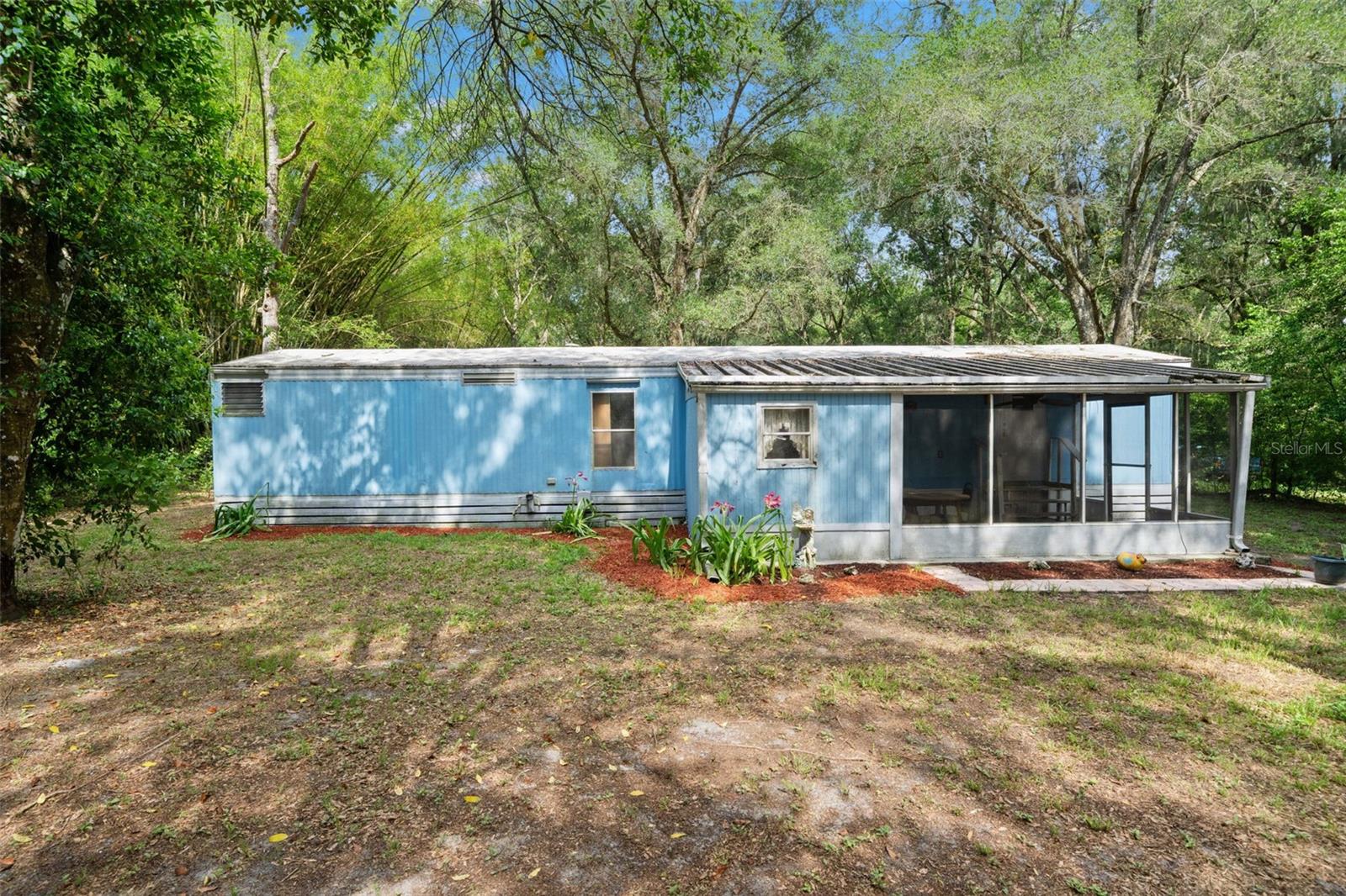 Opportunity awaits in beautiful Brooksville, Florida! Situated on approximately 0.70 acres shaded by mature trees, this 2-bedroom, 1-bath single-wide mobile home offers a spacious floor plan and endless potential. The property is in need of a complete renovation, making it an excellent opportunity for investors, flippers, or buyers looking to create their own private retreat. With plenty of room to expand and enjoy the peaceful natural setting, this property could become a great investment or a future personal residence. Conveniently located near shopping, dining, and local amenities while still offering a country feel. Bring your vision and transform this property into something special. Call today for more details and to schedule your showing!