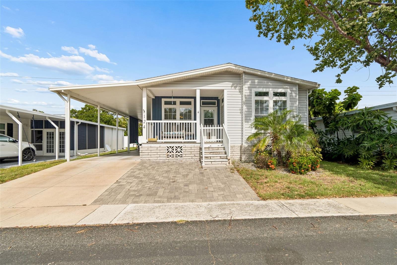 THIS IS THE ONE!!!  WELCOME HOME to this 2019 JACOBSEN IMPERIAL Model Double-wide Manufactured home.  Experience the perfect combination of quality craftsmanship, modern design, and resort-style living in this beautiful home located in the pet-friendly area of the highly sought-after Palm Hill Country Club. Offering over 1,500 square feet of thoughtfully designed living space, this 3-bedroom, 2-bathroom home showcases the superior construction and attention to detail that Jacobsen Homes are known for. Relax on the inviting covered front porch before stepping inside to discover a warm and inviting space with elegant crown molding, finished drywall throughout, custom window blinds, and an open-concept floor plan filled with natural light. Beautiful luxury plank vinyl flooring flows throughout the main living areas, while both bathrooms feature stylish plank tile flooring for a clean, contemporary finish.

Designed with entertaining in mind, the spacious living, dining, and kitchen areas flow seamlessly together, creating the perfect gathering space for family and friends. So many options to enjoy this home inside or out. Weather it's on the covered Front Porch, private backyard, or the double carport to entertain friends and family.

 The chef-inspired kitchen is the centerpiece of the home, featuring a large island with additional seating, a double stainless farmhouse sink, stainless steel appliances, a built-in microwave, stainless range hood, dishwasher, abundant cabinetry, and generous counter space for meal preparation.

The private primary suite is a relaxing retreat with a luxurious en suite bathroom featuring an oversized walk-in shower with a built-in bench. The guest bathroom also offers a walk-in shower, while both bathrooms include convenient built-in storage cabinets. An inside laundry room adds everyday convenience and functionality.  The Two additional bedrooms provide a great space for guest, home office, or Den if needed.

Additional highlights include energy-efficient solar-tinted, hurricane-rated windows, durable vinyl siding, hurricane tie-downs for added peace of mind, and a huge storage shed that provides ample room for tools, hobbies, and seasonal storage. Built with the exceptional craftsmanship and quality construction Jacobsen Homes is known for, this home offers lasting value and confidence for years to come.

Located in the desirable, golf cart-friendly, age-qualified community of Palm Hill Country Club, you'll enjoy a carefree lifestyle with a $595 monthly maintenance fee that includes water, sewer, trash removal, lawn care, cable television, internet, and access to an impressive collection of resort-style amenities.

Residents enjoy three heated resort-style pools, a relaxing spa, 2 beautiful clubhouses, a 9-hole golf course, tennis courts, pickleball, shuffleboard, horseshoes, a billiards room, and a vibrant calendar of social clubs and activities. Best of all, you're just a short drive from the beautiful Gulf beaches, shopping, dining, and everything the Florida lifestyle has waiting for YOU!