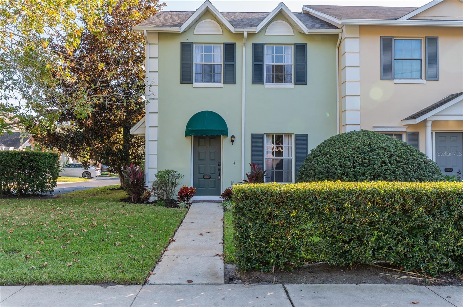This designer influenced townhouse is nestled in the heart of Orlando's coveted Milk District, offering the perfect blend of convenience and charm. You'll find yourself within a close distance of shopping, dining, and the vibrant downtown Orlando scene, eliminating the need for a car. As you approach, the eye-catching curb appeal and Florida-friendly landscaping adorn both the front and side of the property. Step inside to discover the luxurious wide-plank vinyl flooring that graces every corner of this home. Being a corner property, it basks in abundant natural light, creating a warm and inviting atmosphere. The kitchen boasts elegant White Bay cabinetry, sleek quartz countertops, tiled backsplash, and a set of brand-new stainless steel appliances, making it a haven for culinary enthusiasts. Additional perks include a one-car garage with a recently installed door opener, a charming solarium for enjoying summer evenings with friends, and a freshly painted interior. A state-of-the-art air-conditioning system and ductwork and new hot water heater have just been added, ensuring your comfort year-round. The roof is approximately one year old, providing peace of mind. Every fixture, fan, faucet, and mirror is newly appointed and thoughtfully coordinated with the home's theme. All bathrooms have been tastefully remodeled, adding to the home's overall appeal. For a competitive $235 a month the homeowners association takes care of all exterior yard work, fertilization, and pest control, while granting you access to the community pool – making maintenance a breeze. Don't miss this opportunity to claim your slice of downtown paradise!