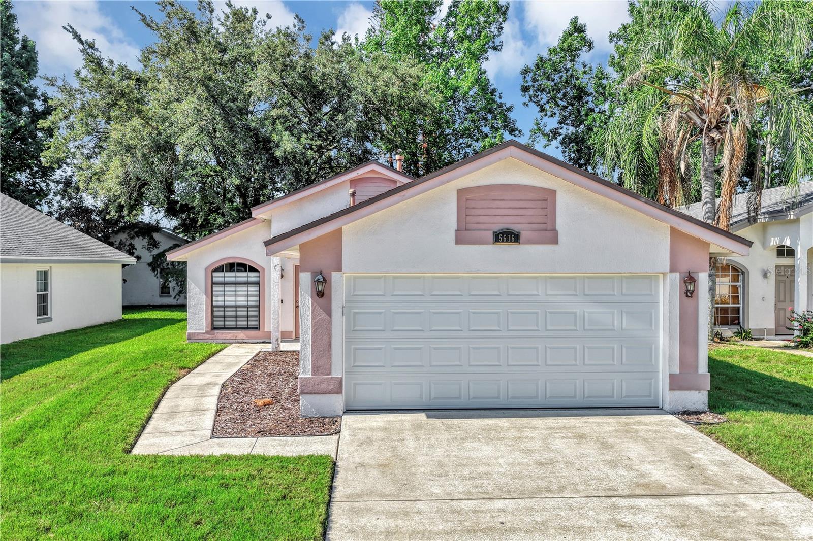 Immaculately maintained one level home in prime desired community!  Layout is open and airy with nice upgrades and improvements including a renovated kitchen featuring Granite countertops, upgraded and pristine cabinets, extensive cabinet storage, complete stainless steel appliances, washer and dryer and more. Kitchen also features pendant lighting, bar top seating and more!  All homes throughout your low maintenance property are tiled! Nice upgraded window treatments in living room and a tall vaulted ceiling! Exiting the kitchen through the French doors lead into a flex/bonus room, that is multi purpose features.  It can be utilized as a family room, dining room, sitting area/Florida room or an elaborate home office!  Imagine the possiblities.  The primary bedroom includes soaring ceilings, a walk-in closet and an en suite bathroom including gorgeous marbled tile.  The guest bedrooms are ideally located, are spacious and brightwith vaulted ceilings and the guest bath includes granite counters and additional counter space.  Air conditioner is (2019) and roof is (2015).  Tremendous location, near Sea World, International Drive, I-4, 528, easy access to downtown, nearby Publix Shopping Center and more!  
HOA takes care of your lawn care as well !   This one has it all and the price makes this an awesome opportunity!