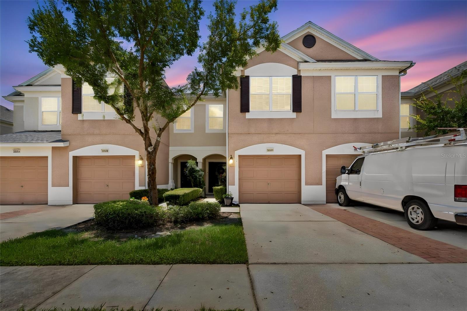 Meticulously Maintained Townhome in the Gated Community of The Bay at Cypress Creek! Welcome to this beautifully cared-for 3-bedroom, 2.5-bathroom townhome with a 1-car garage, perfectly located in the highly desirable gated community of The Bay at Cypress Creek in Wesley Chapel. Step inside to find beautiful wood flooring throughout, creating a warm and inviting atmosphere. The spacious kitchen features rich wood cabinetry, stainless steel appliances, ample counter space, and overlooks the open-concept family and dining room combination, making it ideal for everyday living and entertaining. Conveniently located just off the kitchen and family room is a half bathroom, perfect for guests. Upstairs, the generously sized primary suite offers a large walk-in closet and a private ensuite bathroom, providing the perfect place to unwind. Two additional spacious bedrooms and a full bathroom offer plenty of room for family, guests, or a home office. Enjoy Florida's beautiful weather year-round from your screened-in lanai, the perfect spot to sip your morning coffee or relax with a glass of wine in the evening. At The Bay at Cypress Creek, the HOA provides exceptional value by including water, sewer, trash service, basic cable, lawn maintenance, gated access, and access to the beautiful community pool—making for truly low-maintenance living. Conveniently located just minutes from I-75, Tampa Premium Outlets, The Shops at Wiregrass, AdventHealth Wesley Chapel, and an abundance of shopping, dining, and entertainment, this home offers the perfect combination of comfort, convenience, and carefree Florida living. Don't miss your opportunity to make this beautiful townhome your own!