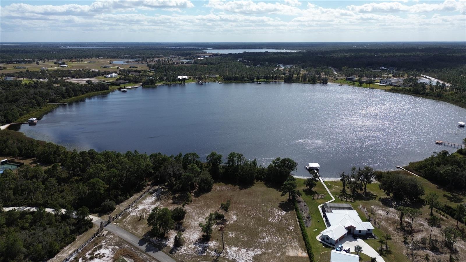 Gated Community of Highlands Lakes Reserve on Lake Ruth with a lake front home site of slightly over 1.5 acres. The community features central water and sewer and paved roads with a 10 acre lakefront park on Lake Charlotte. Standards in place for new construction and plans must be submitted and approved by the HOA committee.  Property can only be viewed with a real estate agent.  No Exceptions..