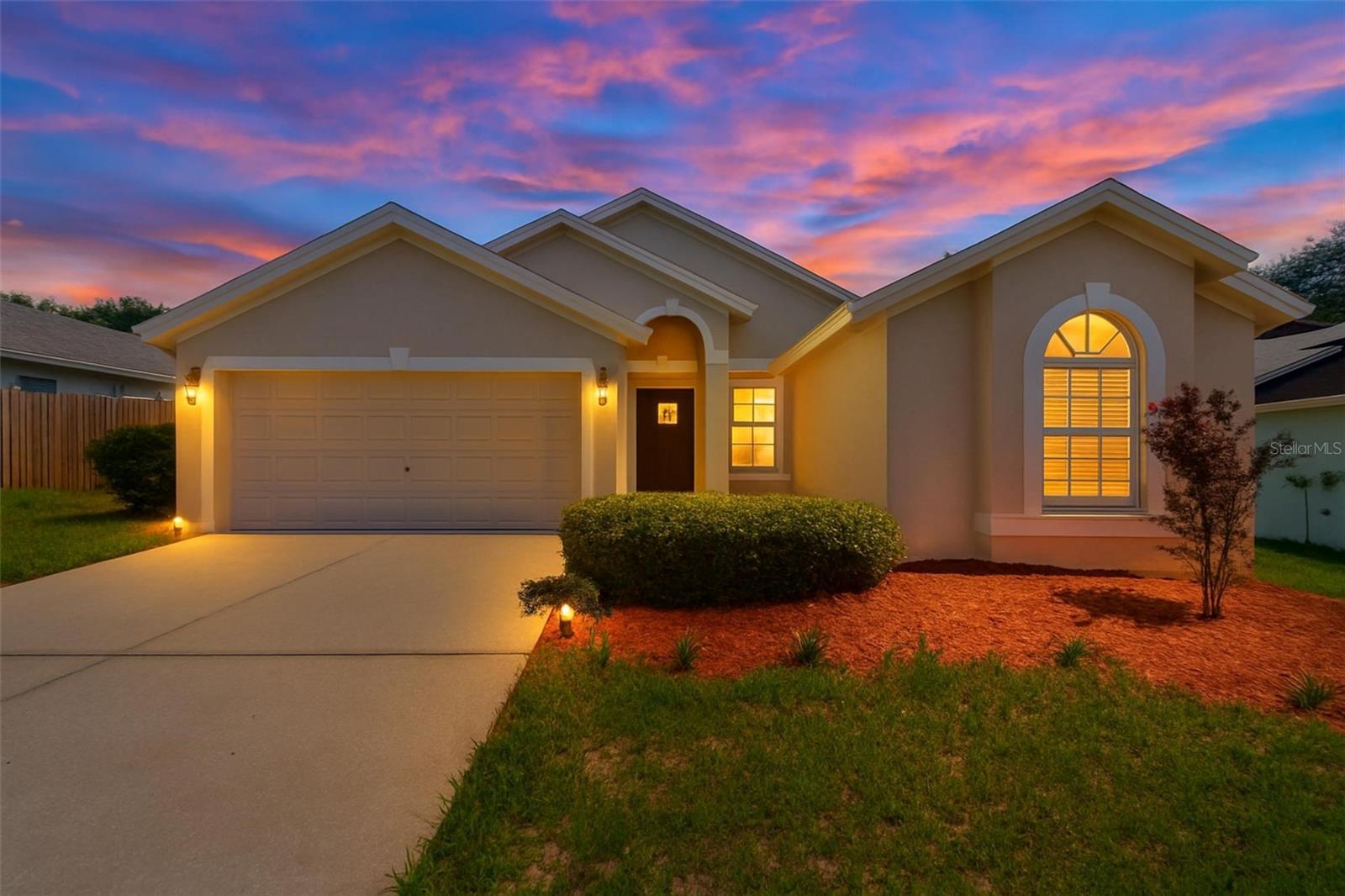 THIS GEM OF A HOME IS MOVE-IN READY, FEATURING 3BR/2BA/2CG, 1,553 SQFT ON .15 ACRES, PRICED TO SELL AT $339,900 AND WON'T LAST LONG!! LOCATED IN THE DARLING COMMUNITY OF OAK GLEN, AKA VALENCIA, IN SEFFNER, THIS HOME IS CENTRALLY LOCATED TO EVERYTHING. Recent improvements provide peace of mind. This home features a NEWER ROOF INSTALLED IN 2/2025, NEWER EXTERIOR PAINT IN 2025, BRAND-NEW CARPET INSTALLED IN JUNE 2026, AND BRAND-NEW STAINLESS-STEEL APPLIANCES THAT INCLUDE A RANGE, RANGE HOOD, FRENCH-DOOR REFRIGERATOR, AND A NEWER DISHWASHER. Step inside the welcoming foyer and immediately notice the light, contemporary color palette and soaring ceilings that create an open, airy atmosphere throughout the home. To the left, you'll find the laundry area and access to the spacious two-car garage. A separate hallway to the right leads to two generously sized secondary bedrooms and a well-appointed guest bathroom featuring an updated comfort-height vanity with a cultured granite countertop, a tub/shower combination, and an additional storage closet.  One of the secondary bedrooms offers a unique built-in window nook, making it an ideal space for a home office, study, or guest room. Continuing through the home, the formal dining area provides a wonderful setting for entertaining and is conveniently located across from the expansive kitchen. Home chefs will appreciate the abundance of cabinetry, generous counter space, and functional layout designed for everyday living.  Adjacent to the kitchen is a bright breakfast nook with room for a dining table and views of the backyard through sliding glass doors, creating the perfect spot to enjoy your morning coffee. The open-concept living areas are enhanced by vaulted ceilings and abundant natural light, giving the home a spacious and inviting feel.
Privately situated on the opposite side of the home, the owner's suite serves as a relaxing retreat. The spacious bedroom easily accommodates a California King bed and features a custom modern headboard that is already mounted, along with dual walk-in closets offering ample shelving and storage. The ensuite bathroom offers an extended vanity, soaking tub, and separate walk-in shower, providing a comfortable space to unwind at the end of the day. Built by Westfield Homes, this residence was originally constructed in 1998, with an effective year built of 2011. Combining thoughtful updates, a functional floor plan, and an unbeatable location, this home presents an outstanding opportunity for buyers seeking value, comfort, and convenience. Oh, and did I mention the location? Enjoy an easy commute to Downtown Tampa, MacDill AFB, shopping, parks, and so much more!!!