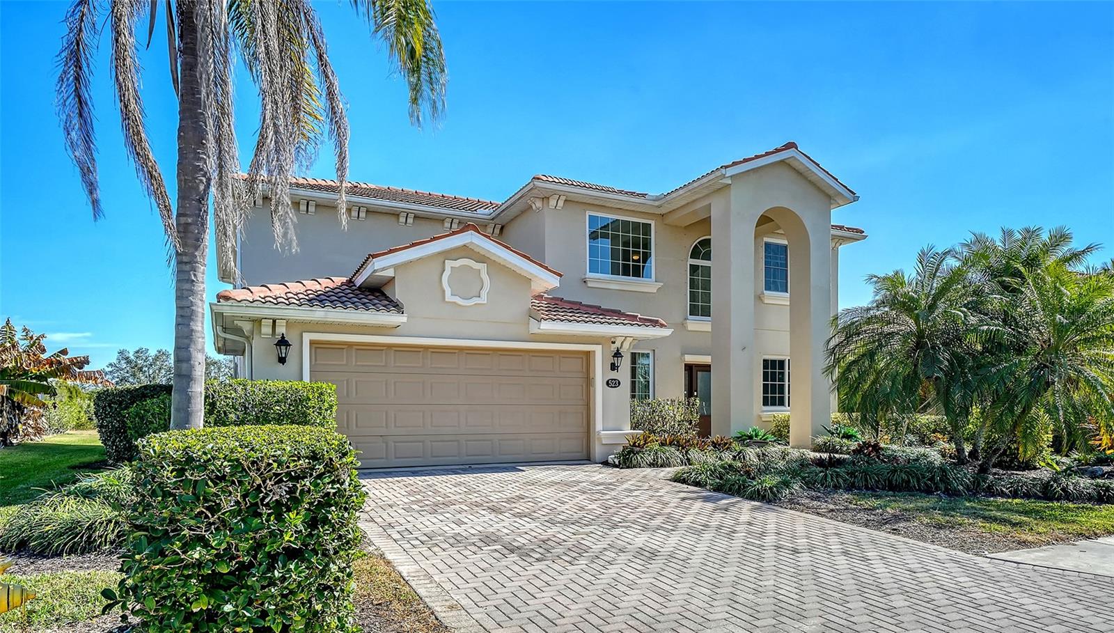 Experience River Strand Country Club, a premier Arthur Hills–designed championship golf community where luxury and resort-style amenities combine to set the tone for inspired everyday living. Where can you find FULL GOLF MEMBERSHIP with fees as reasonable as these? Located on a quiet cul-de-sac, this expansive two-story, 5-bedroom, 3 full and 1 half bath home offers an impressive 2,603 sqft of updated living space, delivering exceptional value at this price point. Recent upgrades include $72,000 in hurricane-impact windows and sliders, renovated kitchen, new exterior paint, new lanai pavers and stylish luxury vinyl flooring throughout the first floor. Soaring 20-foot ceilings and abundant natural light create an open, airy feel upon entry. The dining area is ideal for gatherings and holidays, while the adjacent flexible space easily serves as a home office, playroom, or formal living area—perfect for today’s lifestyles. At the heart of the home is the 2024 renovated GOURMET KITCHEN, featuring crisp white cabinetry, Quartz countertops, a large center island, new appliances, pot filler, designer blue tile backsplash, and abundant storage with full sized pantry. The kitchen flows seamlessly into the living area, creating an inviting space for everyday living and entertaining—all with beautiful views of the quite large heated pool and spa. Step onto the spacious covered lanai and enjoy peaceful preserve views and spectacular sunrises, with frequent wildlife sightings including deer, owls, and native birds—offering a rare sense of privacy and serenity. It is truly magical and sets this home apart from the others. The first floor includes a private guest bedroom, full bath, half bath, and a separate laundry room—ideal for visitors or multigenerational living. Upstairs, the primary suite is a true retreat with a generous walk-in closet and en suite bath, with separate shower and soaking tub. Three additional bedrooms share a full bath. Plush carpeting upstairs adds comfort, and the 2-car garage with epoxy flooring completes the home. Grand Preserve residents enjoy an unmatched lifestyle with a 27-hole championship golf course, tennis and pickleball courts, fitness center and classes, resort-style pools, and a vibrant social calendar. Casual dining and cocktails are available at the Shank Shack and Tiki Bar, with an $8.5 million clubhouse restaurant renovation underway—further elevating the community experience. With modern upgrades, generous square footage, tranquil preserve views, and world-class amenities, this move-in-ready home offers a rare opportunity to enjoy the best of River Strand living—where every day feels like a vacation.