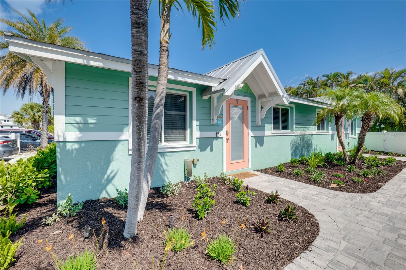 Rarely available gulf-side ground-level villa on the quiet southern end of Holmes Beach — just a 90-second walk to the sugary white sands of the Gulf. This fully updated 2 bedroom/1 bath residence offers the perfect Anna Maria Island lifestyle with all the hard work already done.
The interior features a fully-equipped kitchen with granite countertops and stainless steel appliances, a comfortable living area, and beautifully appointed bedrooms — all turnkey furnished in contemporary coastal décor. Whether you're looking for a primary residence, second home, or income-producing investment, this villa is move-in ready from day one.
This property comes with an excellent rental history and future reservations already on the books into 2027. Anna Maria Island consistently ranks among Florida's top vacation destinations, and Sunset Azul's location and condition command strong repeat bookings year after year.
The community amenities are equally impressive: a shared heated pool with a waterfall feature, a private outdoor patio, lush tropical landscaping, a paver courtyard, and a charming handmade tiki hut — all set within serene, manicured tropical gardens. In-unit washer/dryer, cable TV, high-speed internet, and A/C round out the package.
Perfectly positioned near shopping, restaurants, and trolley stops, yet tucked away enough to feel like a true retreat. Properties this close to the Gulf, in this condition, with proven rental income don't last long on Anna Maria Island.