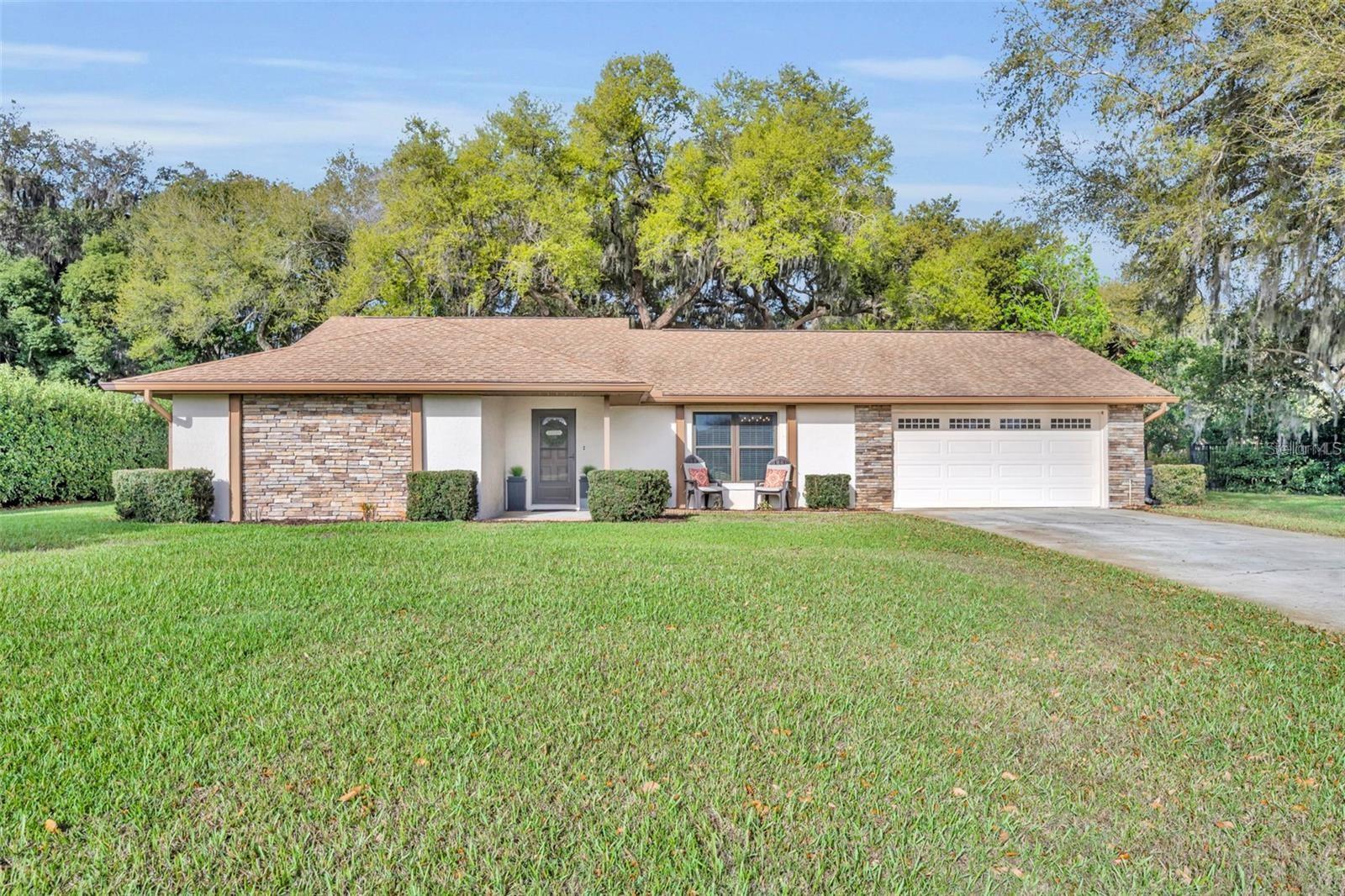 Pool home on 0.58 acres in the gated Lake Ajay Village community with lake views, vaulted ceilings, and beautiful mature oak trees. Welcome to 3158 Whisper Wind Drive, a meticulously maintained single-story home in desirable Lake Ajay Village in Saint Cloud. This move-in ready residence offers 3 bedrooms, 2 bathrooms, and 2,081 square feet of thoughtfully designed living space on an elevated 0.58-acre lot shaded by beautiful live oak trees.
Inside, a neutral split floor plan provides privacy and functionality. Vaulted ceilings in the family and living rooms enhance the sense of space and natural light, while the living room enjoys stunning sunrise views over the lake across the street. A cozy wood-burning fireplace anchors the family room. The spacious kitchen offers ample counter space and storage with adjacent dining areas ideal for everyday living or entertaining.
The primary suite features a large bedroom, walk-in closet, and ensuite bath with dual vanities and a generous walk-in shower. Two additional bedrooms are ideal for guests or a home office. Bamboo flooring flows throughout the home, complemented by tile in the kitchen and bathrooms.
Located on a quiet street in a peaceful, walkable neighborhood, the property also includes a two-car garage, newer roof (2019), energy-efficient dual-pane windows, and a newer water heater (2020). Lake Ajay Village residents enjoy a community dock, boat ramp, recreational amenities, and beautifully lit pickleball courts.
Conveniently located minutes from Lake Nona’s Medical City, Saint Cloud’s charming shops and eateries, nature parks and trails, and zoned for highly rated schools. Orlando International Airport and major attractions are also a short drive away. Schedule your private tour today.