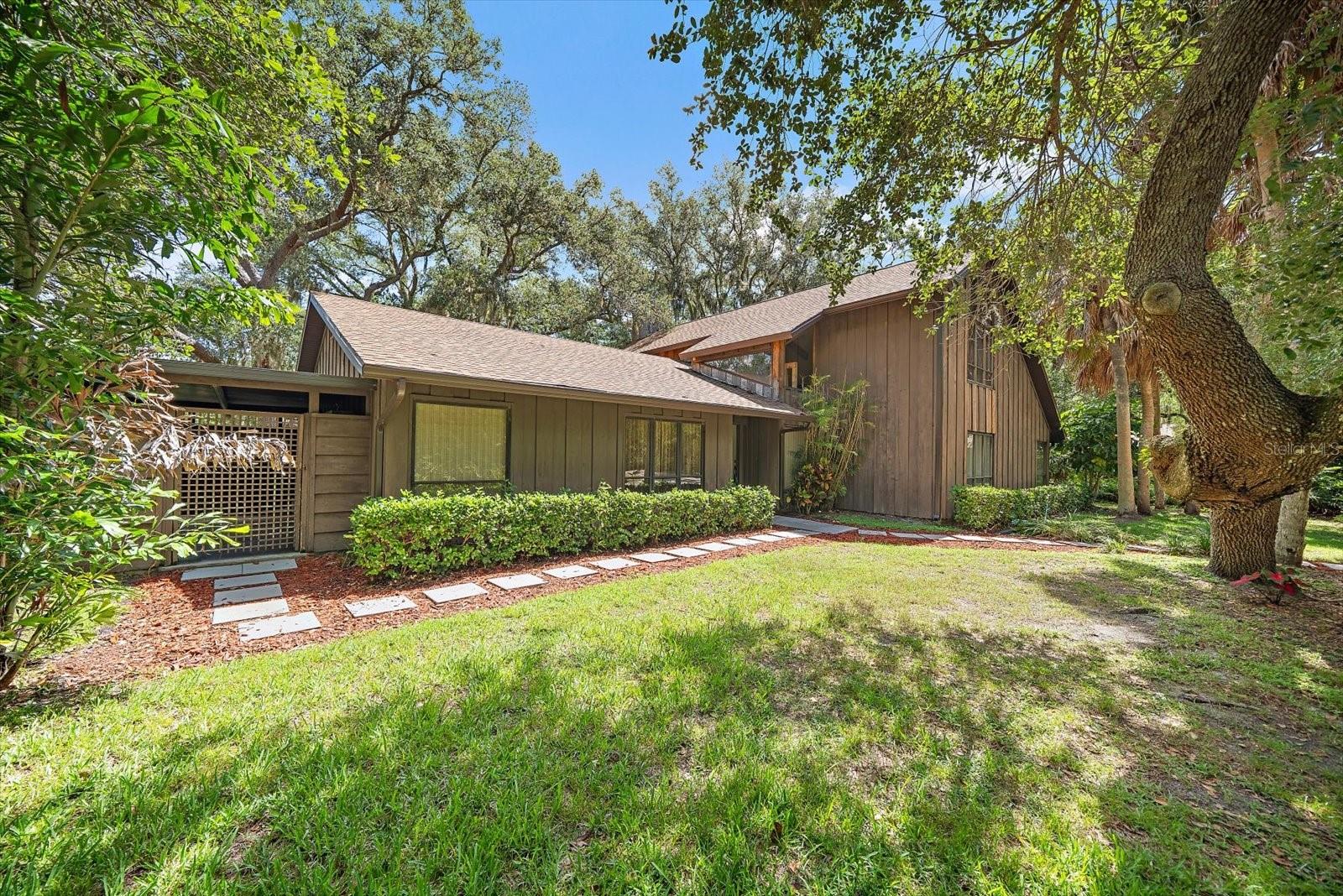 Handyman Special!  Sold to settle estate.  A great opportunity for someone looking for a project that offers a gorgeous private acre lot in a very desirable central Sarasota location! Non deed restricted with gorgeous mature Oaks and a pond at the rear. Although recently occupied, the house does have a lot of wood rot and deteriorated siding and deferred maintenance throughout.  The property is most likely not financeable.  Bring your contractor to assess or buy it for the lot and build your dream home!  Priced accordingly.