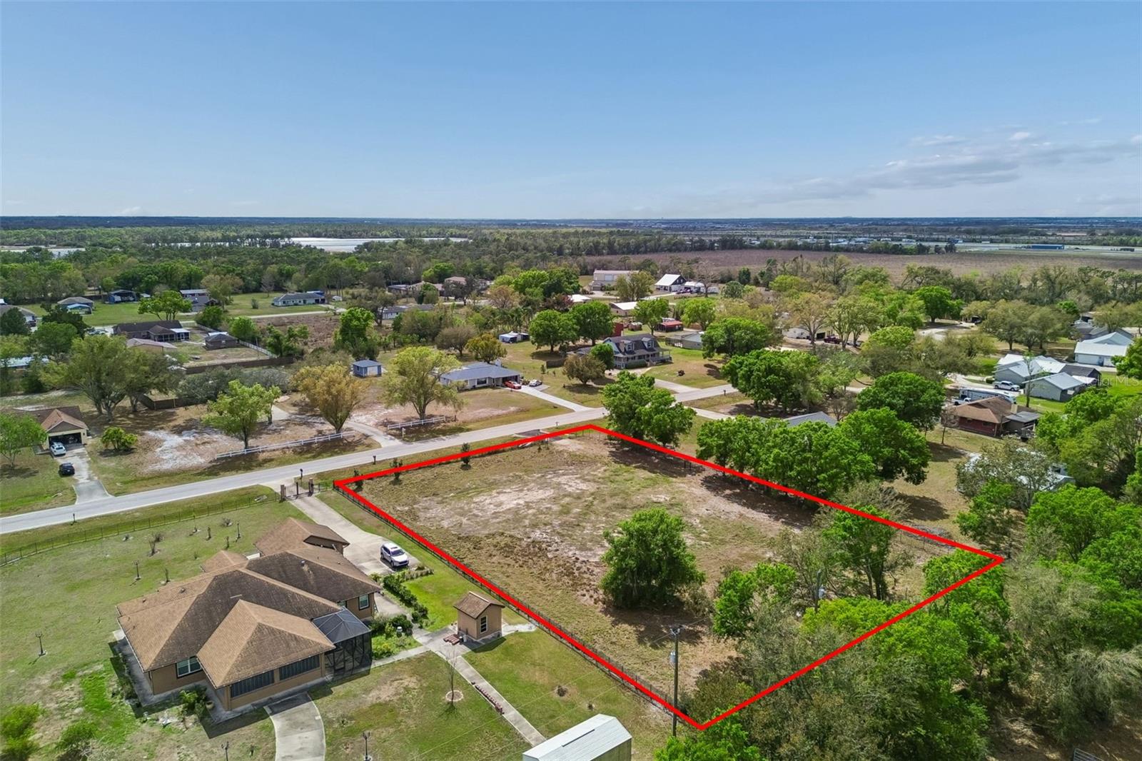 Discover the opportunity to create your ideal Florida lifestyle on this 1-acre homesite in Saddlehorn Estates. This cleared and fully fenced property is ready for your vision, offering a blank slate to build the custom home you’ve been dreaming of while still leaving plenty of room for a pool, workshop, RV storage, or additional outbuildings. Recent improvements include a newly installed culvert, providing convenient and reliable access to the property from the road. With the land already cleared and fenced, much of the initial groundwork has already been completed—allowing you to move forward with your plans more efficiently. Saddlehorn Estates is known for its spacious lots, custom homes, and peaceful setting, giving you the feel of country living while still being just a short drive to the conveniences of Lakewood Ranch, I-75, shopping, dining, and everyday essentials. With no CDD fees and low county taxes, this property offers both flexibility and long-term value. Whether you're looking to build now or hold as a future investment, this homesite offers the space, location, and potential that are becoming harder to find in East Manatee County. Seller financing is available, providing an additional opportunity for buyers looking for flexible purchase options. Secure your piece of land and start turning your vision into reality.