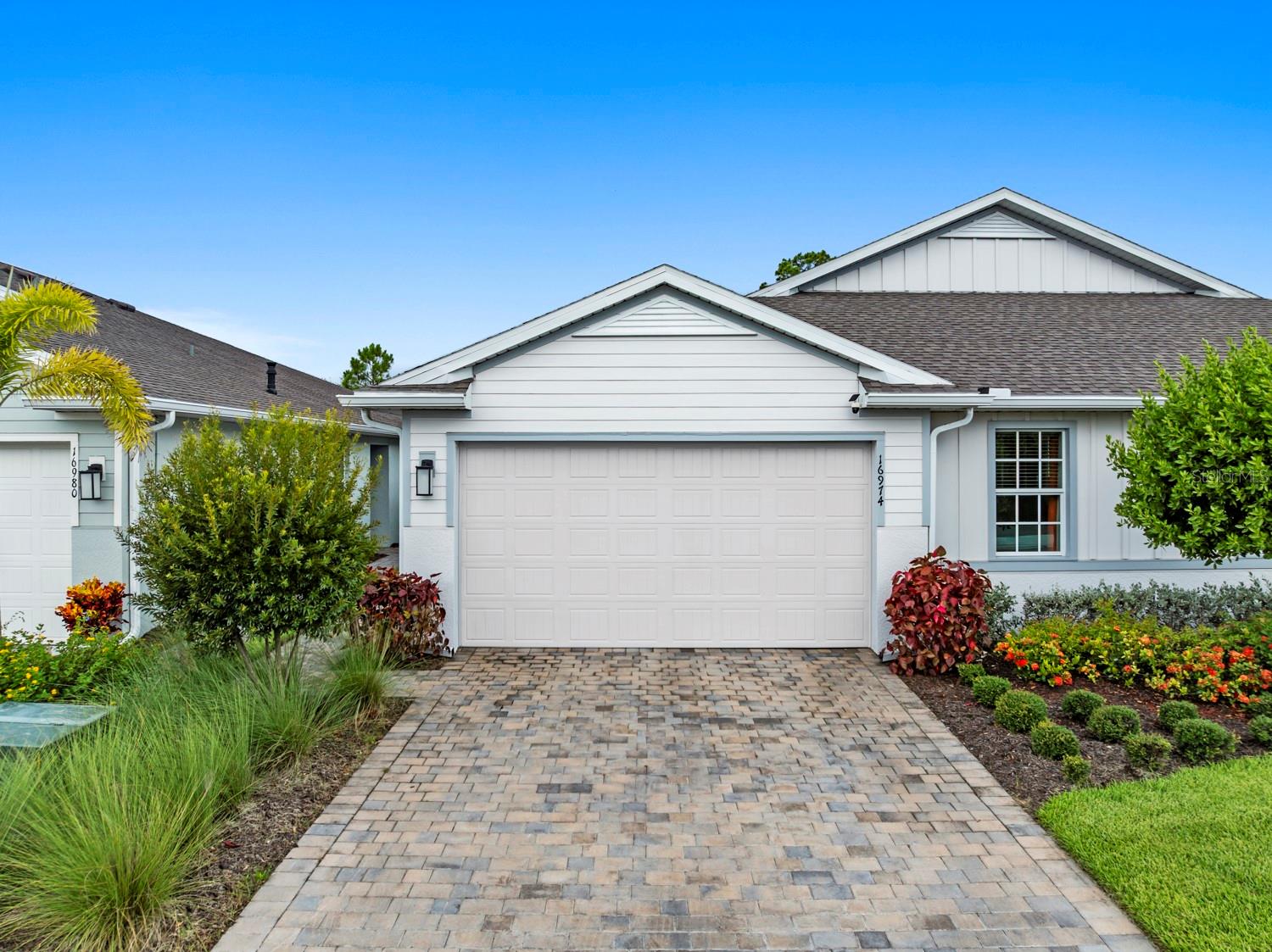 Welcome to this beautifully upgraded Carrington villa in The Preserve at Babcock Ranch! This 2-bedroom, 2-bath plus den home offers the perfect blend of comfort, style, and low-maintenance Florida living.

Enjoy peaceful mornings and relaxing evenings from your screened lanai overlooking a private preserve, where nature provides a serene backdrop with no rear neighbors. Built with impact-resistant windows and doors for added peace of mind, this home also features an open-concept layout with a spacious kitchen, dining, and living area designed for both everyday living and effortless entertaining.

The en suite and secondary bedroom are thoughtfully situated on opposite ends of the home, offering ideal privacy and separation. The en suite bathroom has been tastefully upgraded with a beautiful frameless glass shower enclosure, adding a clean, modern touch to the space.

The garage is a true standout, featuring a durable epoxy floor coating, abundant built-in storage, and a mini-split air conditioning system—creating a fully climate-controlled space ideal for hobbies, a workshop, fitness area, or year-round comfort for vehicles and storage.

Located in the highly desirable Preserve neighborhood of Babcock Ranch, residents enjoy access to resort-style amenities, scenic walking and biking trails, parks, and the unmatched lifestyle of America’s first solar-powered town. With premium upgrades, a tranquil preserve view, and move-in-ready condition, this exceptional villa is ready to welcome you home.