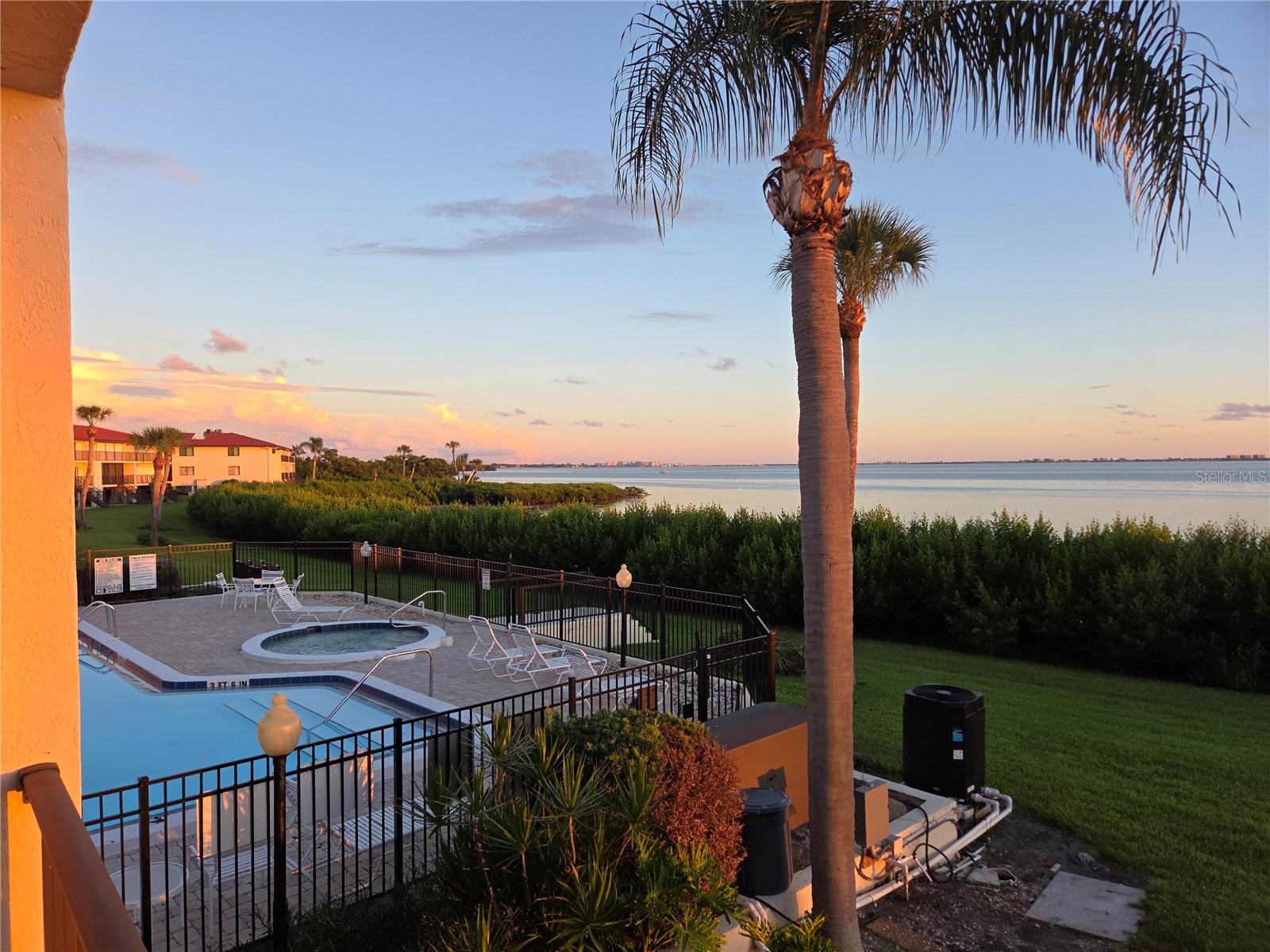 view our famous Florida Sunsets.
Why rent when you can own ... ASK ABOUT YOUR OWN PERSONAL VIEWING

3/2 First Floor Condo Located on Sarasota Bay 
Priced to Sell, nicely updated and ready to move in.

Views of the Sarasota sky-line, the Ringling Bridge and Long Boat Key. Central location to all you may need and walking distance to the IMG where you golfing is available (semi-private country club)

You do not need to be a snowbird ..... The American dream is waiting for you