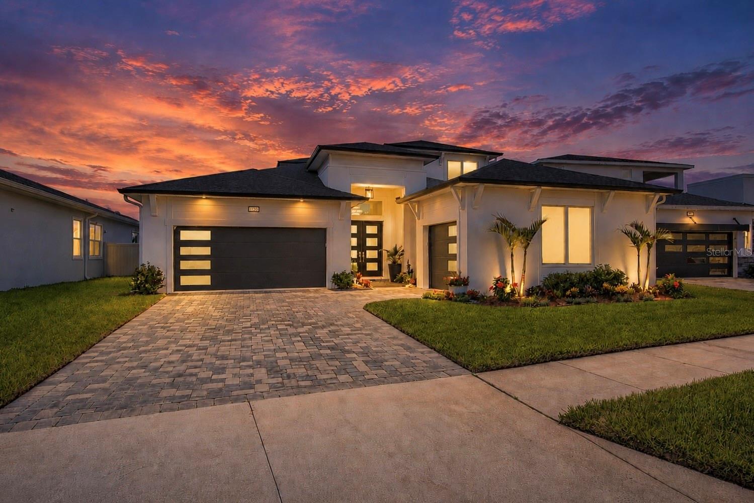 Let's get one thing straight. You can buy a builder home and spend the next two years writing upgrade checks, or you can buy the house everyone wishes they had built and neighbors will be envious of.

Welcome to this stunning DRB Heron I in Eagles Cove at Mirada, perfectly positioned on a premium water-view homesite with beautiful sunrise views over the pond and a backyard designed for living, not projects.

Builders sell potential. This home delivers the finished dream.

The upgrades are already done: plantation shutters throughout, a fully enclosed glass-walled executive office, epoxy garage floors, designer lighting and fans, tray ceilings, upgraded finishes, built-in appliances, induction cooktop, farmhouse sink, oversized quartz island, ceiling-height cabinetry with illuminated display cabinets, and a walk-in pantry.

Offering 4 bedrooms, 3.5 bathrooms, a bonus room, and a split 3-car garage, the thoughtfully designed floor plan provides the perfect balance of privacy and flexibility. The first floor features the luxurious primary suite, a secondary bedroom and full bathroom, a convenient powder room for guests, a laundry room (already plumbed for a utility sink), and the floor-to-ceiling glass-enclosed office with glass doors. Upstairs, you'll find two additional bedrooms, a full bathroom with double sinks, and an expansive bonus room adjacent to a screened balcony overlooking the water—perfect for morning coffee, reading a book, or simply enjoying the view.

The primary suite is a private retreat featuring dual walk-in closets and a spa-inspired bathroom with an oversized frameless glass shower, dual shower heads, dual sink, quartz counters, and designer finishes.

Then there's the backyard. A custom, heated saltwater pool with a stunning 4-foot waterfall feature and an incredible 30-foot lounging shelf takes center stage. The oversized panoramic clear-view screened enclosure, expansive paver deck, extended covered lanai, built-in outdoor kitchen with grill, fenced yard, and peaceful water views create a true resort-style experience. Bonus - the house comes with a safety pool fence. 

And when you're ready to leave your private oasis, Mirada's world-famous Crystal Lagoon awaits with kayaking, paddleboarding, sandy beaches plus the community offers a playground, dog park, community events, and endless recreation.

Luxury without the wait. Upgrades without the headaches. Resort-style living from day one. Enjoy all the benefits of the rapidly growing Wesley Chapel area while tucked inside the award-winning Mirada community, home to the nation's largest crystal lagoon and resort-style amenities. As a golf cart-friendly community, residents can cruise to nearby Saint Leo University, restaurants, grocery stores, and everyday conveniences, with even more shopping, dining, and entertainment options continuing to expand throughout the area.

The builder sold the canvas. This home is your masterpiece.