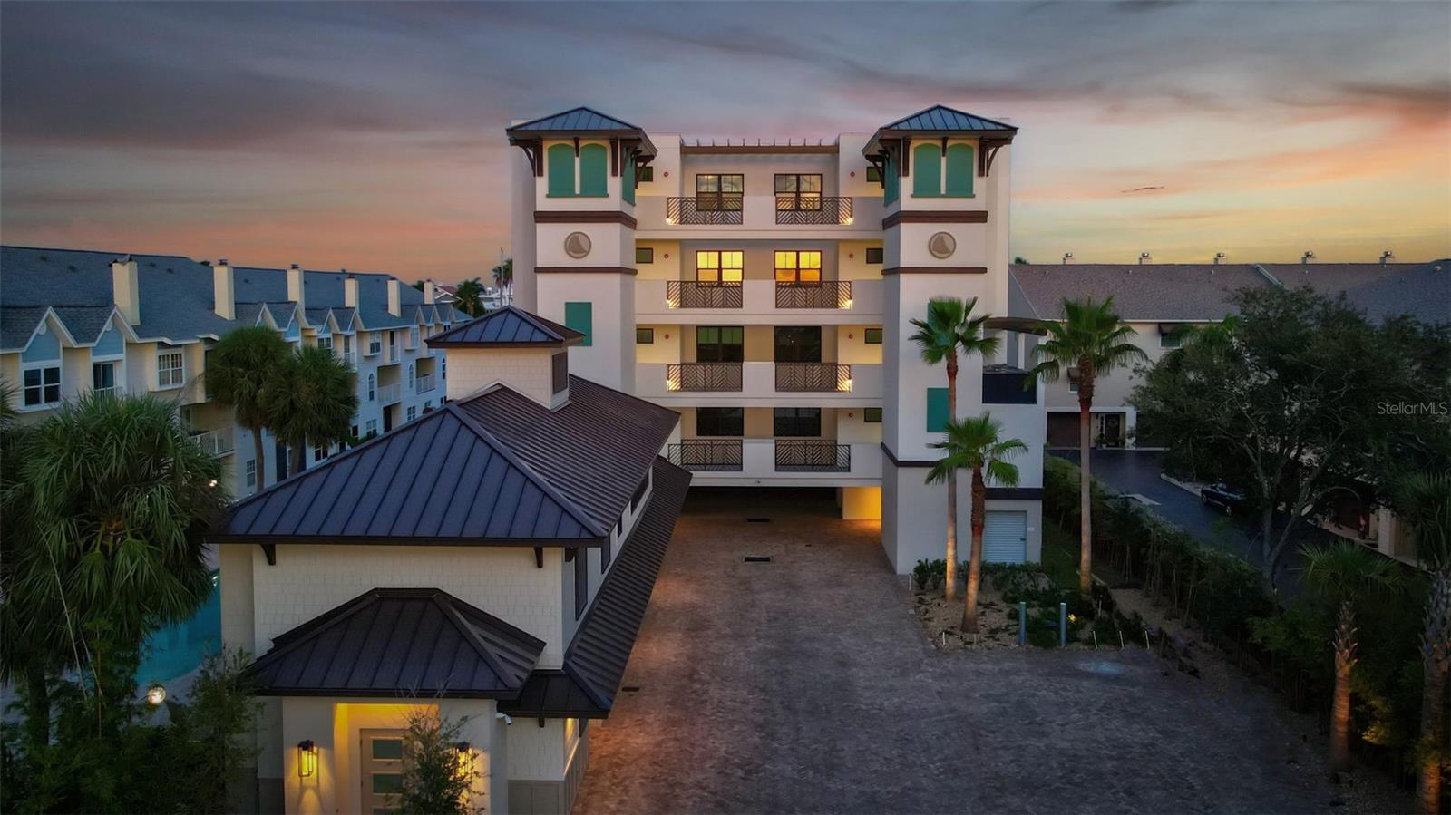 5% SELLER FINANCING, SELLER CONCESSIONS & RATE BUY DOWN AVAILABLE. Welcome to Quiet Cove, an exclusive coastal enclave where timeless design meets enduring construction. This newly built, high-quality waterfront residence offers 3 spacious bedrooms, 3.5 designer bathrooms, den/office a private two-car garage, and exceptional craftsmanship throughout—perfectly blending elegance, comfort, and longevity.

Arrive via secured private elevator access that opens directly into a refined entry foyer. Inside, discover driftwood-style flooring, contemporary lighting, and shaker-style cabinetry, all curated to reflect an elevated coastal lifestyle.

The open-concept gourmet kitchen is a showpiece—featuring quartz countertops, a stunning herringbone tile backsplash, oversized island with prep sink, under-cabinet lighting, premium appliances, and a hidden walk-in pantry. The kitchen flows seamlessly into the dining space and great room, complete with motorized window treatments and access to a deep, covered balcony overlooking the water and resort-style pool.

The owner’s suite is a true sanctuary, boasting a tranquil waterfront sitting area, dual custom closets, and a spa-inspired en suite with double vanities, makeup station, free-standing soaking tub, and a luxurious multi-head rain shower enclosed in glass with elegant tilework.

A second en suite bedroom offers privacy and style with its own walk-in closet and full bath. Bedrooms three and four are generously sized and connected via a beautifully designed Jack-and-Jill bath. The laundry room is equally impressive, with quartz countertops, matching cabinetry, designer tile, and a porcelain farmhouse sink.

Community amenities elevate the lifestyle, including:A large heated pool and separate hot tub, Expansive lounging areas and a covered entertainment deck, The Carriage House with a fitness studio, social lounge, wet bar, and guest facilities, Ideally located just minutes from award-winning Gulf beaches, downtown St. Petersburg, and only 30 minutes to Tampa International Airport. Fort De Soto Park and its pristine natural beauty are just a short bike ride away. This is superior new construction built to last—delivering luxury, location, and lifestyle in one exceptional package.