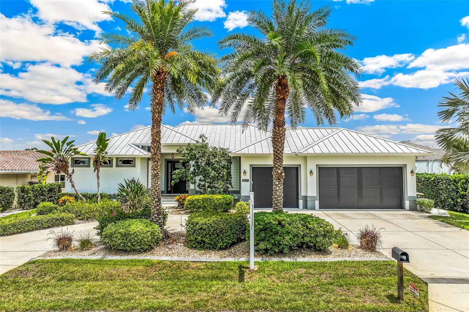 WHY BUILD WHEN YOU CAN BUY THIS LUXURIOUS & STUNNING QUICK access to Charlotte harbor DEEP SAILBOAT WATERFRONT POOL HOME BUILT IN 2017 by local builder loaded with UPGRADES in sought after PUNTA GORDA ISLES sits in a quiet cul-de-sac and boasts canal views 59 ft of seawall. Welcome this 3 bedroom 2 bathroom  3 car garage waterfront masterpiece with a 10,000 lb boat lift with 10 x 8 doc .FULL HURRICANE PROTECTION with KEVLAR SHADE and IMPACT DOORS AND WINDOWS. Designed for both entertaining and everyday living, the open-concept great room layout has high ceilings. Walls of sliding glass doors frame the canal water views and create seamless in door-outdoor connection to the lanai. The gourmet kitchen serves as the Ultimate Gatherering place with stone counters, oversized center island with seating. The split-bedroom floor plan provides privacy and flexibility. The master suite has a Spa-inspired bath with Soaking tub, oversized walk-in shower. Outdoor living takes center attention on the covered lanai with pavers,in-ground heated pool, with night lighting.Outdoor space is perfect for the relaxed waterfront entertaining.Beyond the lanai there is 59 feet of seawall and 14 x 8 deck.
Situated in the sought after sailboat section, offers quick access less than 5 min to Charlotte Harbor and short ride to Gulf, Boca Gande and many waterfront dining destinations. Also short bike ride to historic downtown Punta Gorda with many restaurants and Fishermans Village. Showcasing Coastal West Indies architectual Influence. Newer landscaping and a circular drive and FRESHLY painted exterior,gives a first Impression of Luxury Elegance with Sophisticated status.