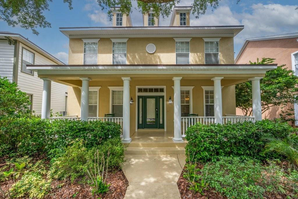 THE PRETTIEST STREET IN FISHHAWK'S GARDEN DISTRICT - OVERLOOKING MULBERRY PARK! Welcome to  the most sought-after model in FishHawk Ranch's Garden District, perfectly positioned on what MANY consider the community's most picturesque and desirable street. This beloved David Weekley "Sparta" floor plan offers an open, airy design filled with natural light and timeless architectural charm. A welcoming Southern-style front porch sets the tone, inviting you to relax and enjoy beautiful park views directly across the street. Inside, a grand foyer is flanked by a private home office and formal dining room, both overlooking Mulberry Park. Elegant finishes throughout include crown molding, Cambria countertops, tile flooring, volume ceilings, and numerous custom upgrades. The gourmet kitchen is a chef's dream, featuring stainless steel appliances, a large baker's island, breakfast bar, cozy eat-in nook with window seat, abundant cabinetry, and generous counter space. The kitchen opens seamlessly to the impressive great room, highlighted by soaring 22-foot ceilings, a fireplace, built-in cabinetry, surround sound wiring, and French door leading to the covered lanai. The first-floor owner's retreat provides a private sanctuary complete with a spacious walk-in closet, luxurious en-suite bath, and relaxing sitting area. Upstairs, you'll find three generously sized bedrooms, two full bathrooms, and an oversized bonus room with built-in closet storage, offering exceptional flexibility for a media room, playroom, or guest space. Designed in the community's signature neo-traditional style, this home also features a covered lanai, spacious yard, connected / covered breezeway leading to your oversized rear-entry two-car garage, and a NEW ROOF. Enjoy an unbeatable lifestyle with Mulberry Park and Playground directly across the street, plus the convenience of walking or biking to top-rated schools, including FishHawk Creek Elementary, Randall Middle School, and Newsome High School. Residents enjoy access to resort-style pools, fitness centers, tennis and pickleball courts, sports complexes, miles of scenic trails, and the shops and restaurants of Park Square. Embracing the principles of New Urbanism, FishHawk Ranch's Garden District offers distinctive architecture, charming front porches, rear alley garages, and a true small-town atmosphere. Conveniently located near Gulf Coast beaches, Tampa, MacDill Air Force Base, major airports, shopping, dining, golf courses, and Orlando attractions, this exceptional home offers the perfect blend of luxury, convenience, and community. Schedule your private tour today and discover why this spectacular home is one of FishHawk Ranch's finest offerings.