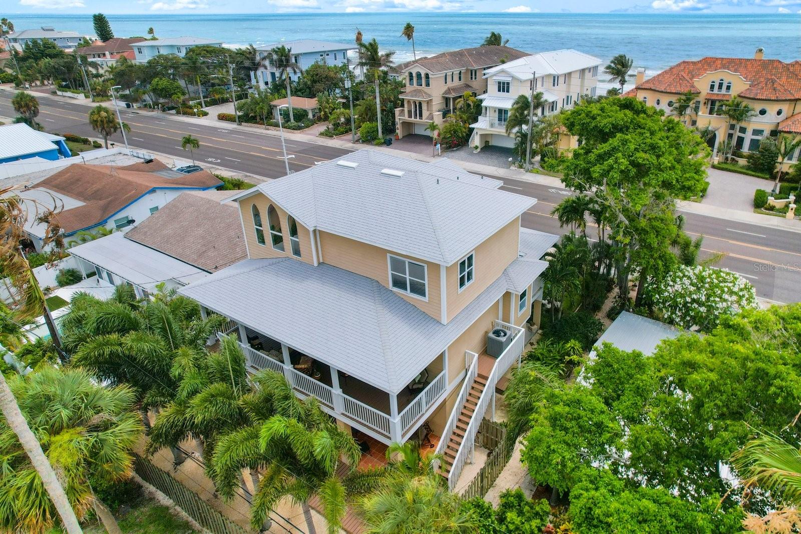 Welcome to your coastal haven, a remarkable Key West style home that beckons to snowbirds seeking a slice of paradise. This like-new, 4-bedroom, 2.5-bath retreat with downstairs BONUS room has been meticulously designed to offer modern comfort and style, making it the ideal escape for those in pursuit of coastal bliss.
From the moment you arrive, the charming Key West architecture and meticulously maintained landscaping will captivate you. Front and back covered porches create inviting spaces for outdoor relaxation and entertaining, surrounded by aesthetically pleasing landscaping that sets the stage for a tranquil escape.
Step inside, and you'll discover an open and bright floor plan adorned with fresh porcelain tile flooring and high ceilings, offering a sense of spaciousness and airiness. The heart of the home, the living room and kitchen combo, exudes elegance and versatility, providing a space for cherished moments with loved ones.
The gourmet kitchen is a chef's dream, boasting top-of-the-line stainless steel appliances, exquisite Cambria quartz countertops, sleek cabinetry, a Shaws Farmhouse sink, and a generous center island. This culinary haven is perfect for creating delicious meals and hosting unforgettable dinner parties.
The master suite serves as a true sanctuary, offering a spacious bedroom with abundant natural light, a walk-in closet, and a stunning en-suite bath. Upstairs, three additional generously sized bedrooms provide comfort and privacy, while a modern full bath adds a touch of luxury. Partial views of the Gulf of Mexico from the upstairs windows offer an extra layer of tranquility.
The backyard provides a serene retreat for relaxation and recreation, surrounded by lush landscaping and offering utmost privacy. Whether you're unwinding on the deck or creating lasting memories with family and friends, this space is designed for enjoyment.  Open the doors and windows and enjoy the outdoor living sunny FL has to offer.  
Every aspect of this home is brand new, from the porcelain flooring to the stainless steel appliances and even a BRAND NEW ROOF. Modern construction techniques ensure energy efficiency and low maintenance, while an oversized 2-car garage and ample storage space in the "basement" make organization a breeze.
As an added benefit, this home is SHORT-TERM RENTAL FRIENDLY, presenting an exceptional opportunity for generating income. Just moments away from the beach, it offers the perfect balance between coastal living and convenient access to local amenities, shopping, dining, and entertainment.
Immerse yourself in the vibrant beachside community, where you can savor stunning sunsets over the Gulf of Mexico. Your snowbird sanctuary awaits – schedule a private viewing today and make this coastal dream your reality!