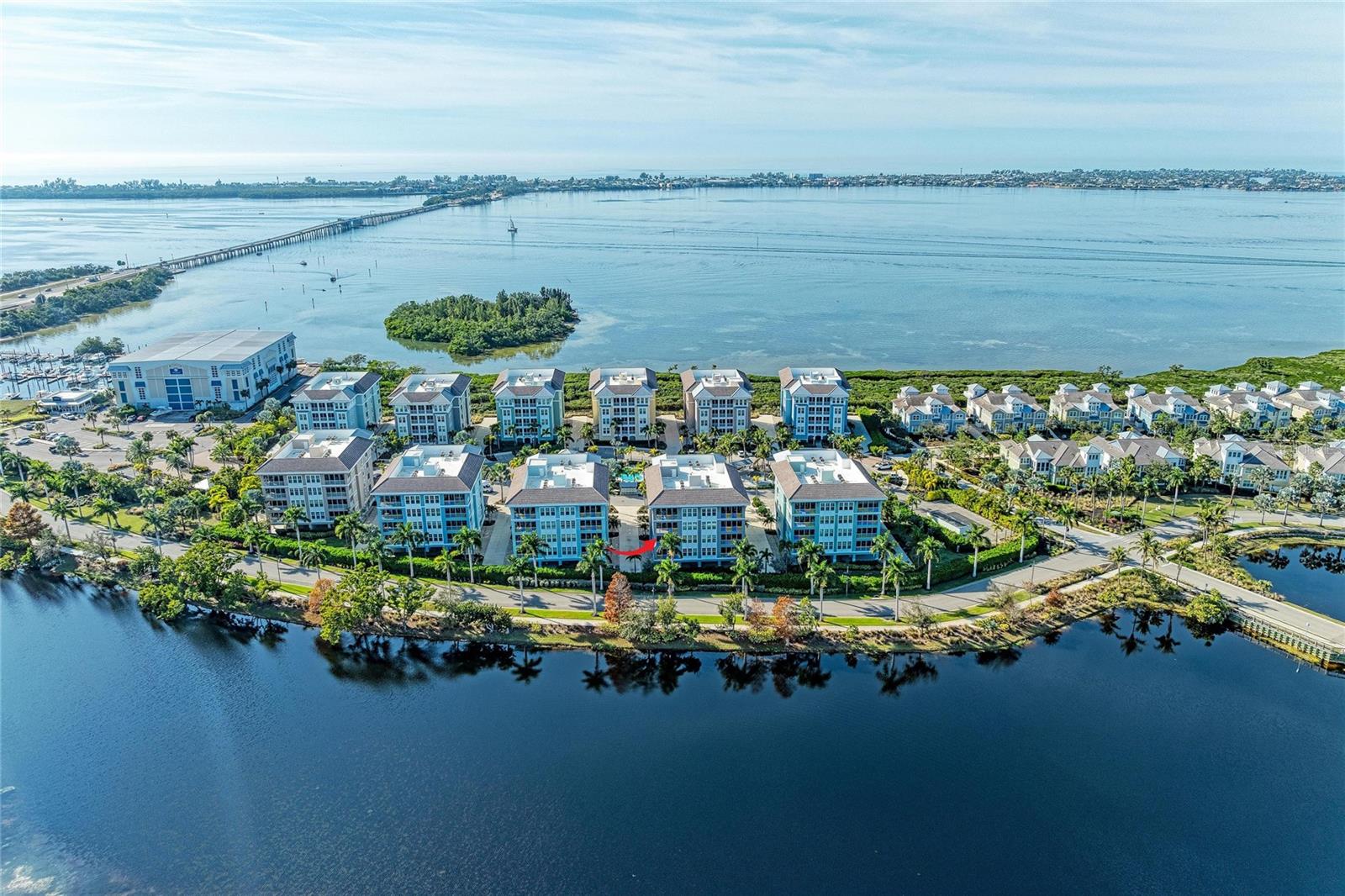 Welcome home to this stunning, move-in-ready condominium offering expansive water views of tranquil Sapphire Lake. Embrace the Margaritaville lifestyle in this beautifully appointed 3-bedroom, 3-bath residence located within the gated Marina Walk community of One Particular Harbour on Anna Maria Sound. Built to withstand Florida’s elements, this solidly constructed home also boasts an excellent rental opportunity, making it an outstanding investment opportunity.

Start your mornings on the expansive private screened lanai, savoring a cup of coffee as the sun rises over Sapphire Lake and the protected mangroves of Perico Preserve. This amazing condo showcases high-end upgrades throughout, including LG stainless steel appliances, solid wood cabinetry, quartz countertops, custom lighting in the kitchen and dining areas, and elegant wood plank tile flooring in the main living spaces. Additional features include an open-concept floor plan filled with natural light, an assigned under-building parking space, and a private storage room perfect for beach gear. This light, bright, and airy home is designed to impress, with high ceilings and a dramatic wall of glass sliders that flood the space with natural light and showcase serene water views. Elevated décor creates a warm, inviting atmosphere throughout. A thoughtfully designed split floor plan offers privacy for all, separating the primary suite from the guest bedrooms. With two additional bedrooms, there’s plenty of room for family and friends to relax comfortably—along with ample space and amenities to keep everyone entertained. The amazing furniture is negotiable. This community is a gated community with 24 hour virtual guard and pest guard control.

Located within the highly sought-after Harbour Isle community, residents enjoy resort-style amenities designed for relaxation and recreation. Unwind at the private beach club overlooking Anna Maria Sound, complete with the Sky Bar restaurant, a heated resort-style pool and spa, and a state-of-the-art 4,200-square-foot fitness center. The community also offers four pools, cabanas, a splash pad, grilling areas, a playground, fire pit, kayak launches, scenic walking trails, and a full-time activities director hosting a variety of events.

Just under a mile away, Anna Maria Island offers pristine beaches, charming island ambiance, over 30 dining options, and boutique shopping. Boating enthusiasts will appreciate the nearby Safe Harbour Marina at Pier 77, only a short walk from the condo. Steps outside the gated community, enjoy Floridays Restaurant and the Compass Hotel, both inspired by the Margaritaville lifestyle. Nature lovers will love being only two miles from Robinson Preserve, featuring miles of trails for walking, biking, and kayaking, as well as easy access to three nearby nature preserves. Pickleball enthusiasts will enjoy the state-of-the-art G.T. Bray Recreation Center, located just five miles away, offering 20 courts—14 of them covered.

This is truly paradise. Whether you’re seeking a full-time residence, a vacation getaway, or a lucrative investment property, this exceptional condo delivers it all. Schedule your private showing today and experience the breathtaking water views and unmatched lifestyle that await you at award-winning Harbour Isle.