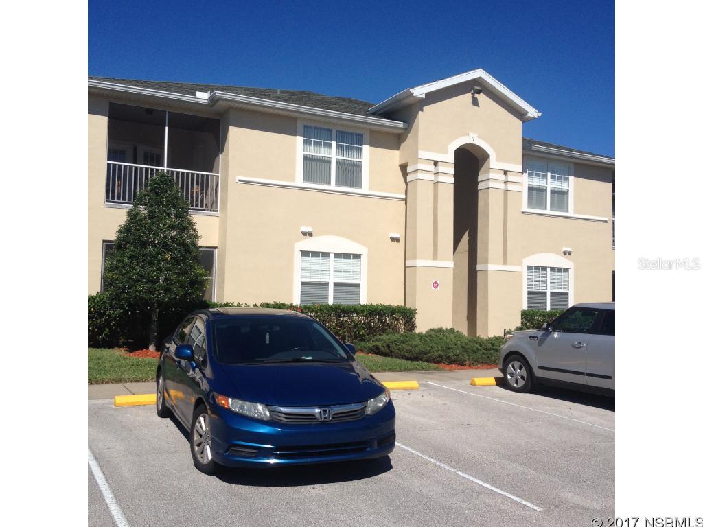 Spacious 2nd floor condo, located in a very prestigious location in Port Orange. This unit has 2 bedrooms and 2 baths with a split floor plan which allows for privacy. Each bedroom has volume ceilings & large walk-in closets. Large open kitchen with wood cabinetry, full appliance package with plenty of storage inside and out. This unit offers an inside utility room with full size washer and dryer. The low maintenance fee covers, basic cable, pest control, water, sewer and trash. You also are assigned a deeded covered parking space for your safety and convenience. Whether you are looking to purchase your dream residence, second home or investment property, look no further, this is the one! ;LocationDescription: Condo ;Water: City