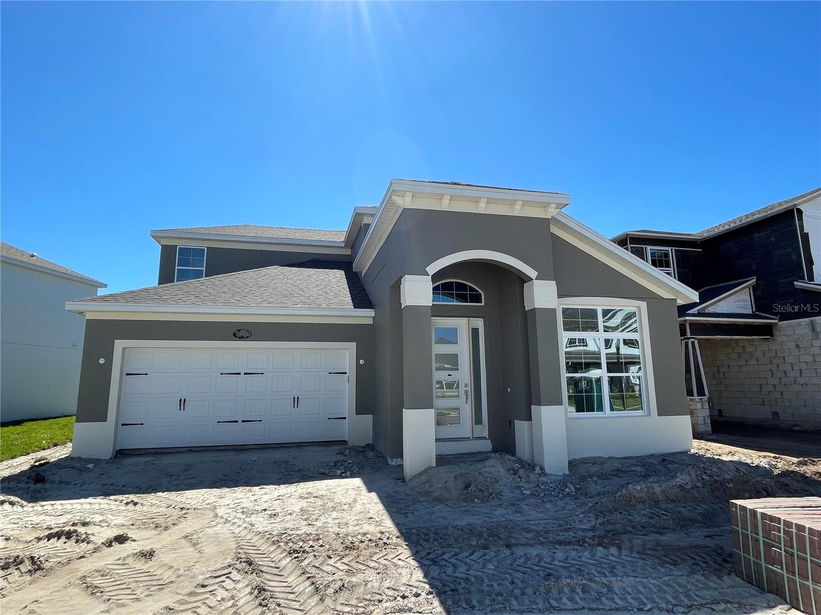 Under Construction. This gorgeous Spec home has extensive use of ceramic wood look tile downstairs and in all of the bathrooms. Master bedroom is on first floor with two separate vanities and two huge closets. Very open concept with a separate dining room, that could also be used for an office.  Kitchen has a gourmet kitchen with fancy stainless steel hood vented to exterior of the home, Level 3 white cabinets, single bowl stainless steel sink, quartz counter tops through out the kitchen and bathrooms. Kitchen has some nice upgrades such as a drawer with trash bins and crown molding on top of cabinets. Bathrooms have tile to the ceiling. Master bathroom has a semi-frameless shower door. Upstairs loft has double doors leading to a balcony with composite decking. This dream home has magnificent views of the pond and conservation area.