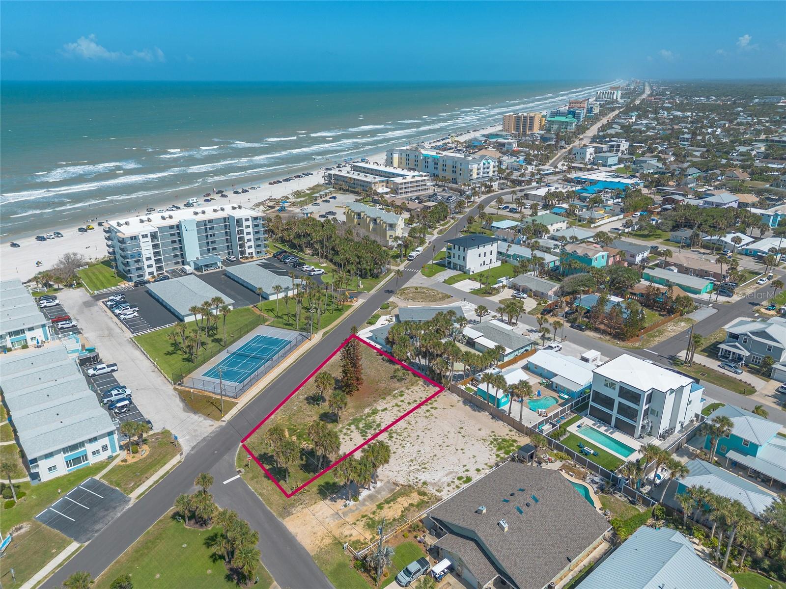 Across from the Beach!  Location, location, location! This 0.32 Acre, 18,470 sq ft lot is at the corner North Atlantic Ave/Due East just steps to the ocean and is waiting for your home. Close to Flagler Ave restaurants, shopping and entertainment, this lot provides convenient access to all the amenities you need while offering the tranquility of being near the ocean.  Own this versatile lot with endless potential.  Ocean views are possible with a 2-story home.  Zoned for 30 day rentals. Floor plans available for a 3 story home. Home was scraped, Impact fee credits may be available.
