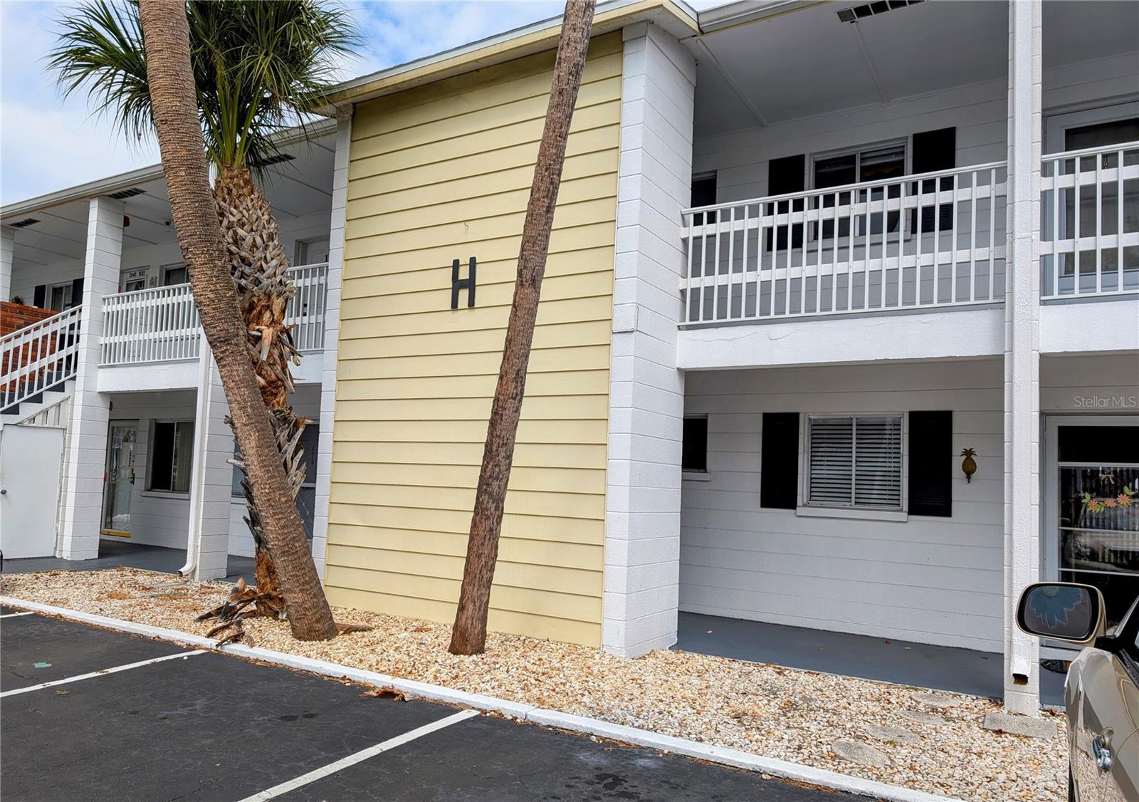 WOW... Have you been dreaming & wishing for a cost-effective winter or full-time place? Not too late! Look at this price! 1BR/1BA on 2nd (top) floor. Compact. Adorable. Immaculate. Seller is a minimalist! Beautiful kitchen cabinetry. Gleaming easy care laminate flooring thru main ares. Screened lanai offers a quiet, shady setting on the courtyard! HOA only $253/mo. Great location...just a couple blocks to Bayshore Gardens Shopping Center (new Publix & Chick-fil-A, Target, TJMaxx, etc). Come check out this active, busy, 55+ community & its heated pool, clubhouse, large coin laundry, even a picnic table & grills for cookouts! Public bus stop is at end of street and there are plenty of nearby places to eat & enjoy as well as banks, medical offices, golf courses & miles of beautiful beaches. Now is ABSOLUTELY the time to act. Interested? Don't wait...