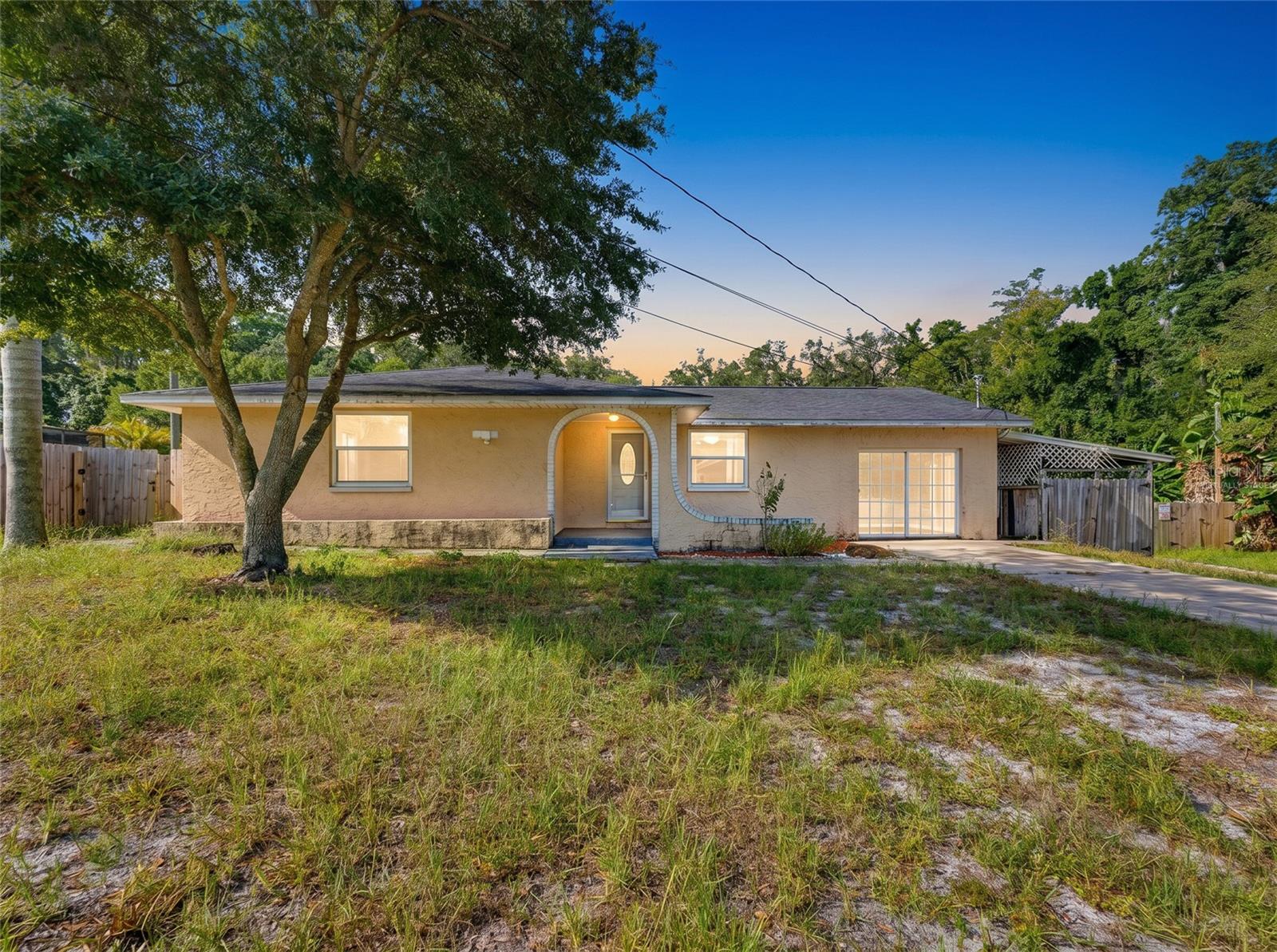 Tarpon Springs Opportunity! This spacious three-bedroom, two-bath home is full of potential and ready for its next owner. Featuring an open floor plan, an updated kitchen, a large mudroom with washer and dryer hookups, a screened porch, and a fenced backyard, this home offers a solid foundation for your personal touches and improvements. Enjoy added privacy with the adjacent lot owned by the Florida Department of Transportation and the property behind it owned by Pinellas County, creating a setting that is unlikely to be developed any time soon, if ever. Conveniently located just minutes from the historic Tarpon Springs Sponge Docks, you'll have easy access to waterfront dining, unique shops, and the city's rich culture. You'll also enjoy a short drive to Fred Howard Park, Sunset Beach, and Honeymoon Island, where you can experience some of Florida's finest beaches, boating, fishing, and spectacular Gulf Coast sunsets. Whether you're an investor looking for your next fix-and-flip project or a homeowner with the vision to build sweat equity, this property presents an outstanding opportunity. Come take a look and see everything this Tarpon Springs gem has to offer before it's gone!