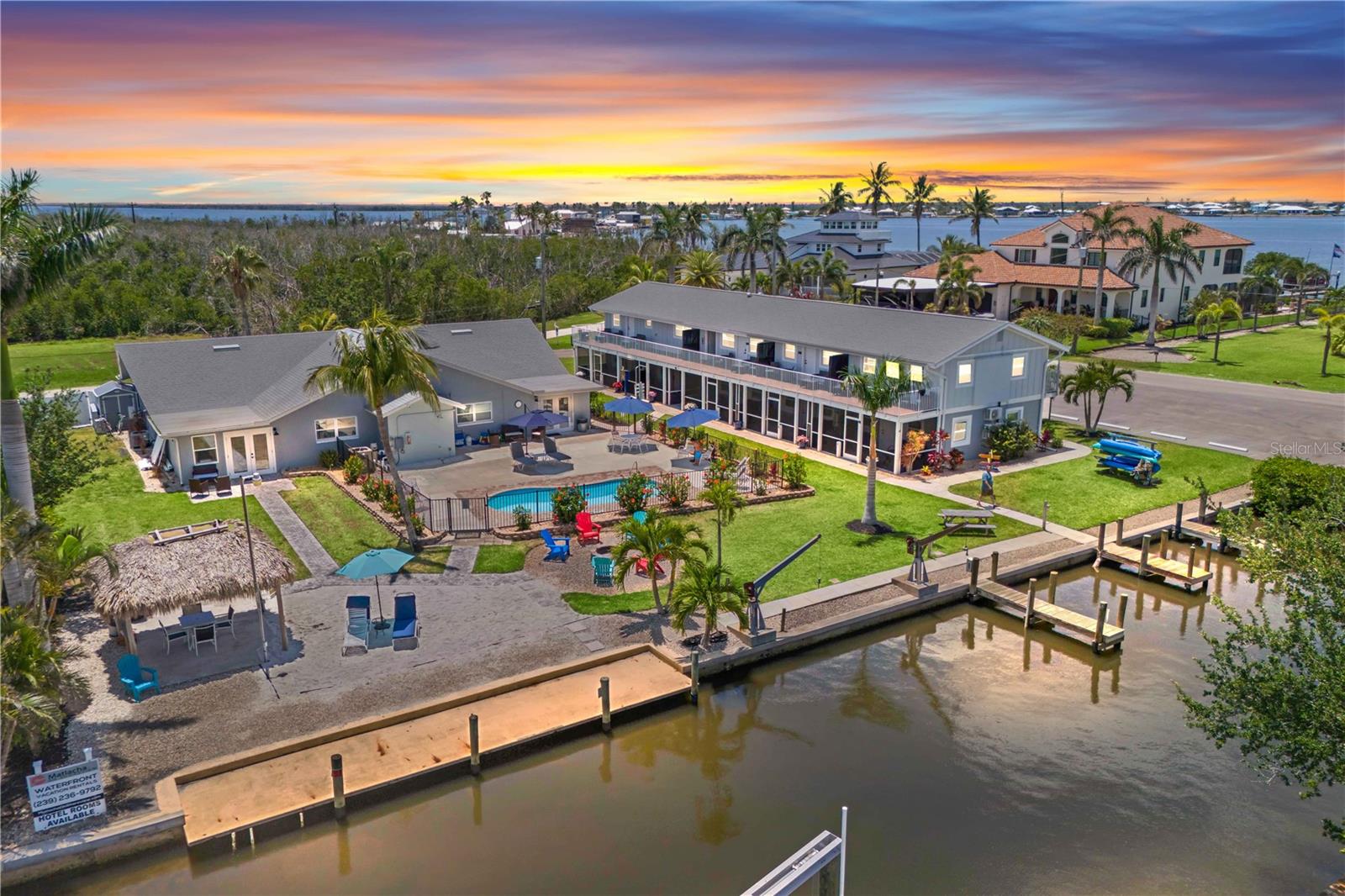 Matlacha on Shoreview is a premier waterfront hotel in the heart of Matlacha, offering 12 fully furnished units with breathtaking 360-degree water views and direct access to a private dock—perfect for boating, fishing, and enjoying the vibrant coastal lifestyle. Each spacious unit features modern amenities such as air conditioning, private bathrooms, kitchenettes or full kitchens, and balconies or patios, ensuring a comfortable stay for every guest. The property boasts an inviting outdoor pool, sun terrace, and beautifully landscaped common areas, creating a relaxing atmosphere ideal for both short-term getaways and extended stays. Guests can take advantage of on-site laundry facilities, free Wi-Fi, and ample parking, while outdoor dining areas, grills, and a firepit offer opportunities for al fresco gatherings. Located just steps from the colorful shops, art galleries, and acclaimed waterfront restaurants of downtown Matlacha, this well-maintained hotel consistently receives exceptional reviews for its cleanliness, hospitality, and unbeatable location. With strong, consistent rental income and a reputation as a top destination in a highly desirable market, Matlacha on Shoreview is an outstanding choice for those seeking a unique Florida coastal experience. Matlacha is a charming coastal village reminiscent of Key West forty years ago and is a mecca for artists, fishing and boating. This opportunity also provides an option for multi family and is a rare chance to enter the hospitality world in this area. Full financials and pro-forma to be provided upon request.
