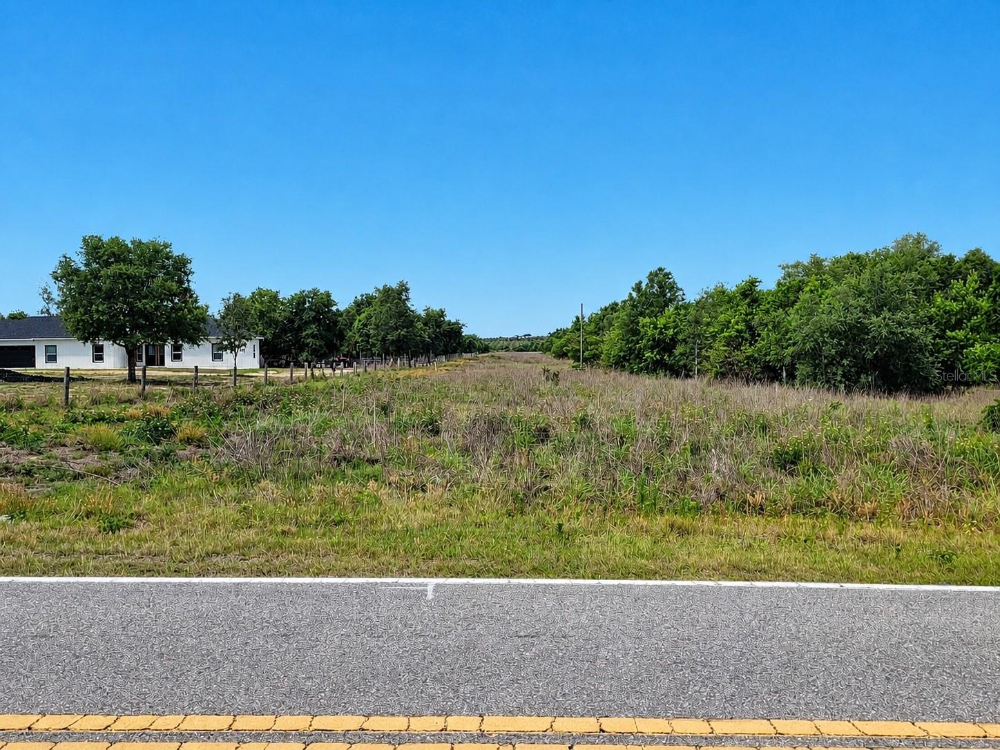 Are you searching for the perfect piece of Florida countryside with PRIVACY, freedom, and endless possibilities? Welcome home to this beautiful 4.98-acre property in peaceful Lake Wales. Mostly cleared and ready for its new owner, this rare property is ideal for building your dream home, placing a mobile or modular home, and enjoying a quiet country retreat.

Surrounded by scenic rural beauty with orange grove views across the street, this property offers the charm of country living while still being conveniently located near shopping, dining, schools, and major roadways. NO HOA gives you the flexibility to truly make the property your own. Bring your RVs, boats, and outdoor toys — there’s plenty of room to spread out and enjoy the Florida lifestyle.

The large cleared area helps save time and expense for future development, while the peaceful setting creates the perfect escape from busy city life. Located near popular attractions such as Bok Tower Gardens, Lake Pierce, boating, fishing, and hiking trails, this property offers both tranquility and convenience.

Per county records, approximately 3.47 acres are designated residential use, with additional area associated with pipeline easement. Buyer and buyer’s agent to independently verify all property information, zoning, land use, easement restrictions, and intended use with Polk County and applicable authorities.

Opportunities like this are becoming harder to find in growing Polk County. Don’t miss your chance to own your own slice of Florida paradise.