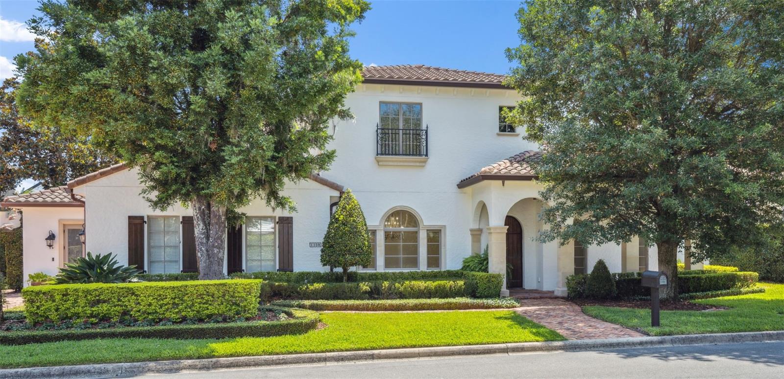 Truly exceptional Downtown Winter Park home with all of the character and amenities that make this lifestyle so sought -after. Well designed floor plan combines expansive open kitchen/gathering room as well as a large formal dining room and separate living room. Three way split bedroom plan offers two bedrooms downstairs and three bedrooms upstairs. Fifth bedroom is best suited for additional office or media room upstairs. Well-appointed kitchen with Wolf gas range, unique onyx mosaic backsplash, loads of storage and island seating. Ideal for entertaining with French doors leading to large covered terrace overlooking  an incredible waterfall pool. The backyard feels like a private resort- in addition to the heated pool and spa, enjoy a gas firepit with built-in seating and an outdoor kitchen- all surrounded by lush tropical landscaping. Relaxing upstairs terrace with views of WP golf course. Other notable features include newly painted interior, charming front porch.  Ten foot ceilings and walls of windows throughout afford abundant natural light. Downstairs laundry room plus a second floor laundry closet for another washer& dryer. There is a charming second entry designed with built-ins for an ideal mudroom/drop zone. Architectural details include crown moldings, custom designed wrought iron, stone columns and a beautifully lit tray ceiling in primary bedroom. Real (not paver) brick driveway, porches and pool deck.  Mature landscaping with tropical palms, magnolias and signature oaks. This home has been impeccably maintained and exudes quality throughout. Of course, the location is one of the most outstanding features of this home- Walk to Farmers market, Park Avenue shoppes and restaurants and of course the Winter park 9 just one house away.