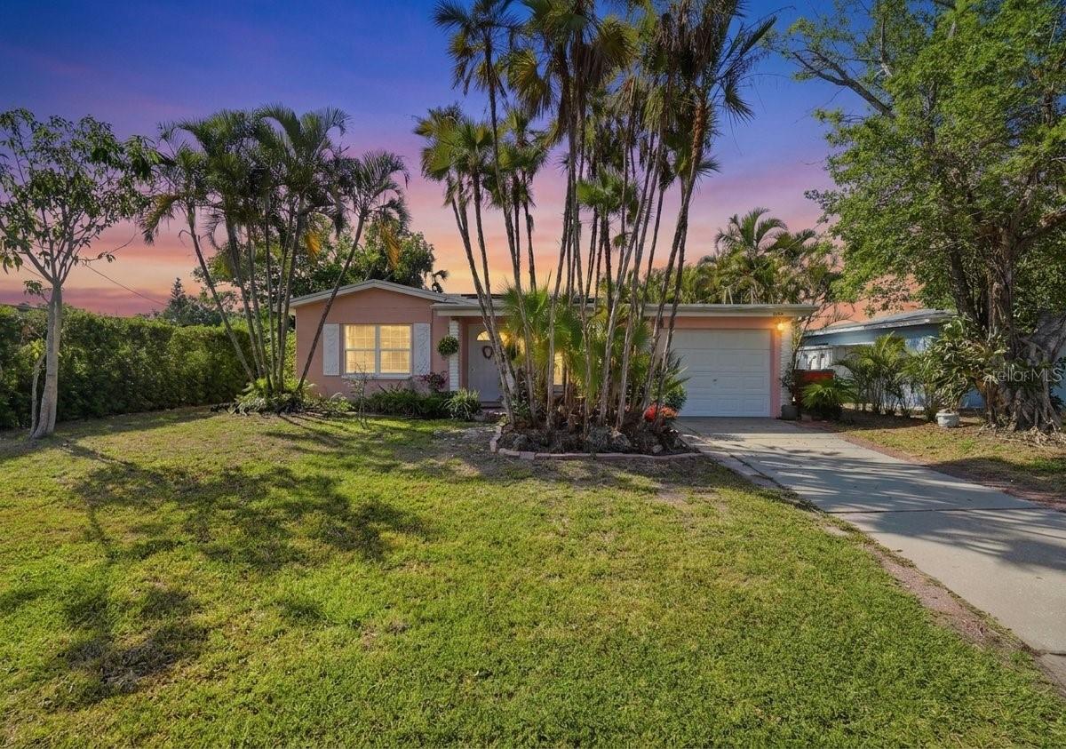 Virtually Staged. WATERFRONT! Welcome to 6650 Hibiscus Ave. South - a Mid Century waterfront home located in sought-after South Pasadena. This home offers a rare opportunity to enjoy a tranquil natural environment without sacrificing convenience, could be a great short-term vacation rental located on boatable water. Just minutes from the 'Old Florida' charm of Gulfport, the beautiful sands of Treasure Island and St. Pete Beach, great restaurants, shopping, galleries, vibrant downtown St. Pete, and 2 International Airports - it's the perfect balance for today's Florida living. This concrete block home features a generous split floor plan with 3 bedrooms and 2 full bathrooms (hall bath and primary en-suite bath). There's lots of storage in this home - plus a large bonus room / office area with water views, an attached utility / storage room, a designated laundry room with washer & dryer hookups, and a large 1-car garage with a 9 ft. wide door and automatic opener. Enjoy a low-maintenance tropical landscape with established mature palms and shrubs. Updates include a new roof in 2016, solar panels in 2020, A/C system in 2023, and water heater in 2024. This is truly a unique opportunity to live on the water in this amazing area - your waterfront gateway to fun and adventure, with plenty of room on your back patio for entertaining and relaxing in your tranquil private oasis. Your backyard also has perfect access for kayaking, paddleboarding, fishing, and boating - with access to Boca Ciega Bay and the Gulf of Mexico. Or simply enjoying your backyard watching the wildlife, or the sun setting on the water - keep a lookout for your local Manatee or Dolphin swimming by! According to the current owner, the home was impacted with about 4 inches of water during hurricane Helene in 2024, the current owners also said it was the first time they had experienced any flooding since purchasing the property in 1995. This waterfront home is just waiting for your renovation, remediation and personal design touches. A floating dock may be added for your boat or kayak, buyer and buyer's agent should verify with the county for feasibility, specifications and permitting of any dock. All measurements are approximate. Buyer and buyer's agent to verify all information, measurements, renovation and permitting requirements. No wholesalers or contract assignments. Property is being sold as-is, where-is. NO REPAIRS!