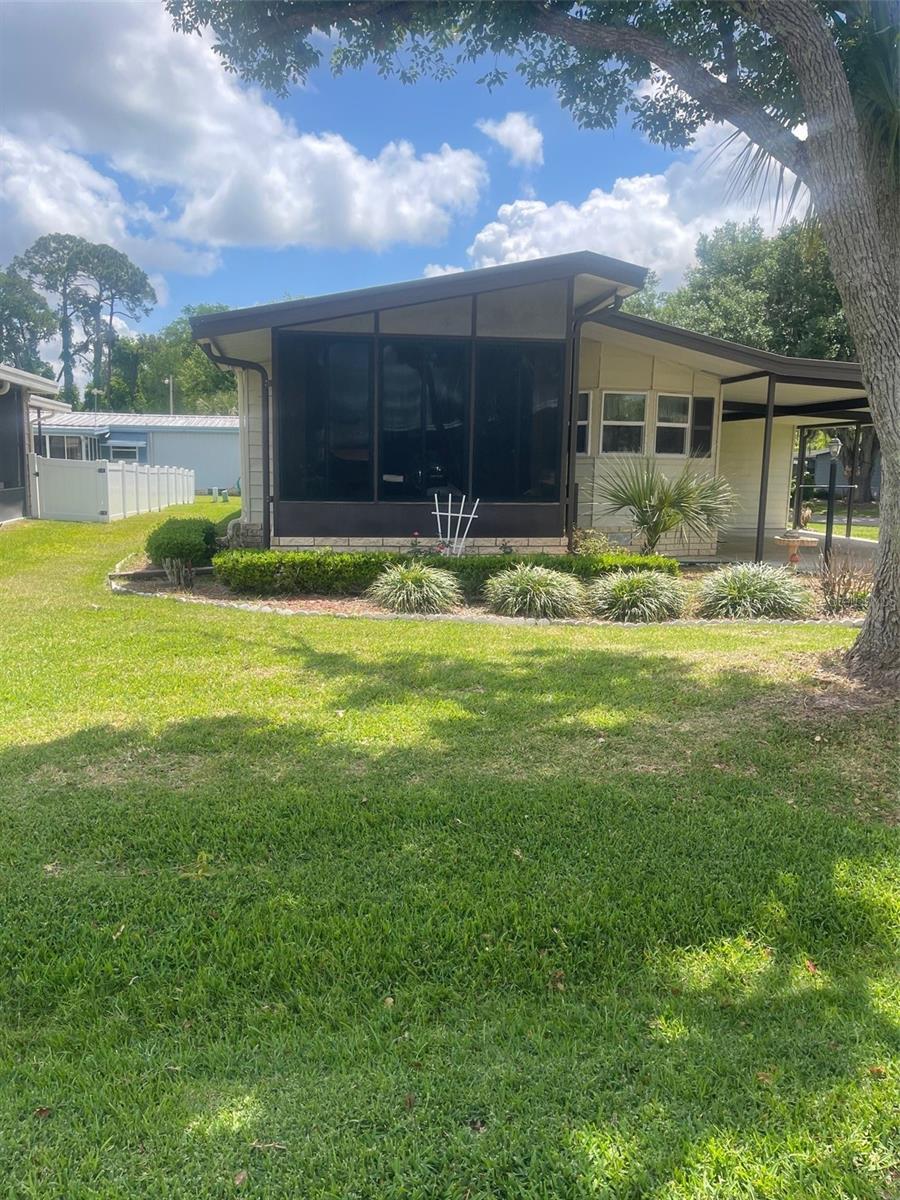 Boating and Fishing Enthusiasts welcome home!  Canal front community... Spacious 2 bedroom 2 bath home located at Fox Run in Tavares. There is a 12'x12' front enclosed Florida room to enjoy your evenings. Huge master bedroom, with dual closets and dual sinks in bath. Inside utility room equipped with washer and dryer. The kitchen is fully equipped. This home is fully furnished and vacant, just bring your suitcases and move right in. There is a workshop/shed and a huge carport. The Clubhouse provides a large room available for events, heated pool, fitness center, shuffleboard, and a park. There is a private boat ramp with canal access to Lake Harris and the Harris Chain of Lakes available only to residents. You may store your boat along the river side,  slips available to residents only. No need to store your boat.