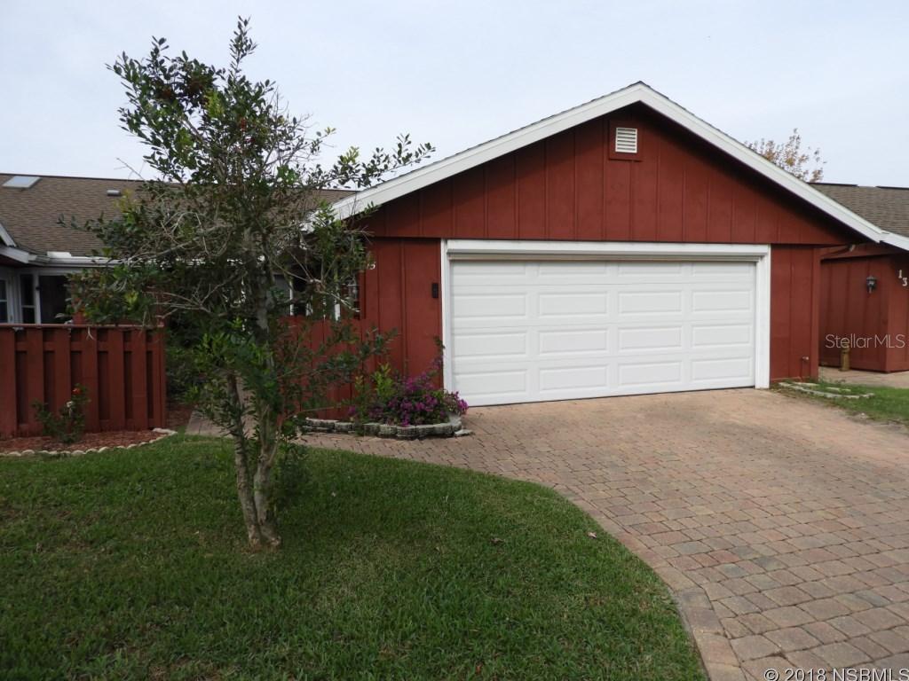 Golf Villa is priced affordably and ready for new owners. Updated kitchen with bay window overlooking entry courtyard, new wood cabinets, tile backsplash  and new counters, as well as newer appliances. Spacious great room enjoys light from skylight, and leads to Florida room and private patio to enjoy the outdoors. New 2.5 ton/14 seer AC system, new in 2016. New 2013 water heater. Architectural shingle roof 2006. Master suite features another bay window for lots of natural light. Guest bedroom has 2 closets for lots of storage. Screened entry porch has ornate entry gate and tiled floor. Nestled between 2 golf courses, and walking distance to community heated pool, available by optional membership to Fairgreen residents. Central location, close to shopping, dining, downtown New Smyrna Beach and minutes to the beach. Nominal HOA dues provide termite bond and irrigation system and water to it. Easy to see, call to take a look! ;Water: City