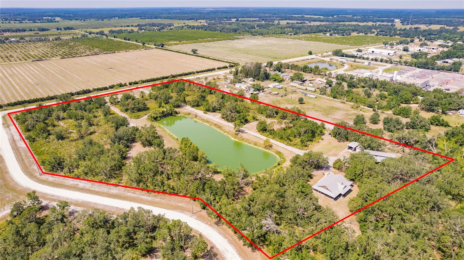 Escape to a stunning farmhouse-style retreat on 15 peaceful acres. Located at 5826 Hwy 72, this property is ideal as a personal residence, an income-producing Airbnb, or a private weekend escape. It features a 1-bed, 1-bath barn loft, a 4-bedroom, 2-bath home, a large barn perfect for entertaining, and plenty of space for all your animals. A long private driveway welcomes you in and leads to the charming home, where an open floor plan keeps the space bright and easy to enjoy. The bedrooms are spacious, and the primary suite offers a walk-in shower and timeless farmhouse details. The metal roof is in excellent condition, giving you extra peace of mind. The property is zoned for horses and offers endless outdoor fun. Spend your days fishing in the large scenic pond, grilling with friends, or relaxing beneath the beautiful mature oak trees. The kitchen opens to both the screened-in front porch and the covered back porch, perfect for enjoying quiet mornings or sunset views. With all 15 acres fully fenced and gated, you’ll have room to spread out and enjoy true country living. You’re just minutes from Downtown Arcadia, I-75, and everything Southwest Florida has to offer, while still being able to slip away into your own private oasis at any time. This property is full of southern charm and endless opportunity. Schedule your own personal tour today!