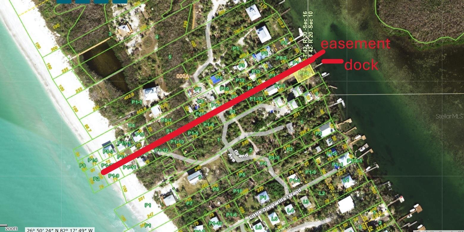 This 50’ x 75’ bay front lot, complete with its own dock, provides a rare opportunity to create the island cottage you have always envisioned. Electricity and water connections are conveniently located nearby. The property also includes a deeded easement, granting direct access from the bay to the Gulf of America. Nestled on Little Gasparilla Island—a tranquil, bridgeless barrier island just off the coast of the Cape Haze Peninsula—this lot offers a peaceful retreat away from the hustle and bustle. The island is celebrated for its friendly community and serene atmosphere, featuring no shops, restaurants, or car traffic. Residents meander along sandy trails shaded by lush tropical foliage and enjoy 3½ miles of unspoiled beaches, ideal for collecting seashells and hunting for sharks’ teeth. The adjacent home, currently for sale under listing D6144794, has permission to use the dock situated on this bay lot. By purchasing both parcels, you can reside in the existing home while building your dream residence on the bay front property.