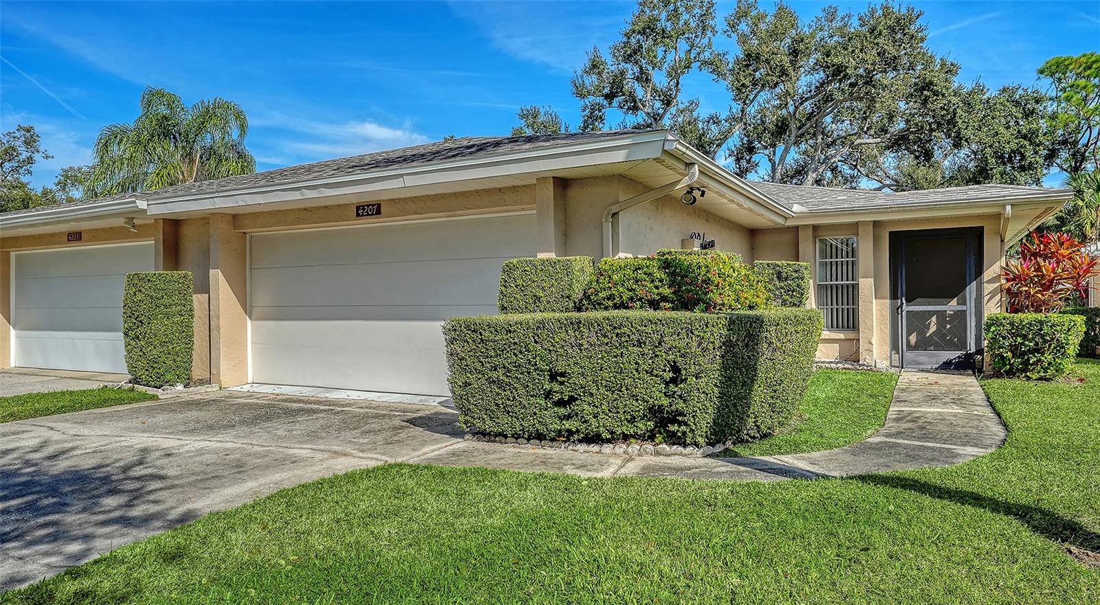 Pride of ownership is evident the minute you walk into this two bedroom, two bath attached villa with a new roof in 2023.  Located in the sought after neighborhood of Center Gate, this 55+ community offers something special for the both the full-time resident as well as the snowbird.  This unit has been lovingly cared for; freshly painted, new window treatments and comes furnished.  There is tile in the main living areas and cozy carpet in the bedrooms.  The kitchen has quartz counter tops and solid wood cabinets.   The spacious lanai looks over the tranquil green belt.  A generous two car oversized garage completes this unit.  The Center Gate community is close to all that Sarasota has to offer, shopping, beaches, downtown, healthcare and the Interstate.   Time to join this welcoming community and make this special unit your own slice of paradise in the sun.