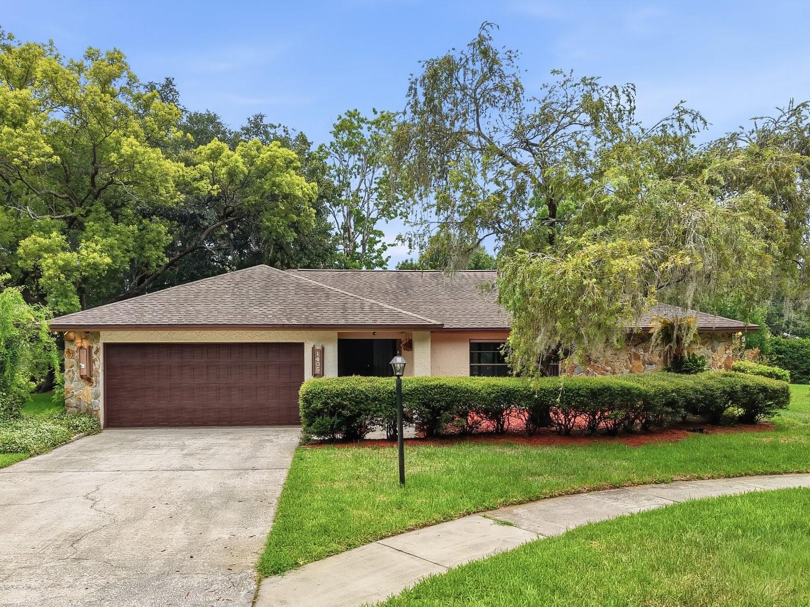 Welcome to 1405 Laurel Court, where move-in-ready comfort, generous outdoor space and the appeal of an established Plant City neighborhood come together. Tucked away on a quiet cul-de-sac in Walden Lake East, this spacious 3-bedroom, 2-bath home offers 2,146 square feet of living space on nearly half an acre—providing room to relax, entertain, garden and enjoy the Florida sunshine.

Inside, fresh interior paint and brand-new luxury vinyl plank flooring create a bright, updated feel throughout. The home has also been thoughtfully improved with a new HVAC system, newer appliances and a freshly painted garage floor. With a roof approximately nine years old and no required flood insurance, several major ownership considerations have already been addressed.

Walden Lake East offers a welcoming, established community atmosphere enhanced by thoughtfully planned parks, green spaces and walkways. Residents can also enjoy access to a community swimming pool, play area and tennis facilities, creating opportunities for recreation and connection close to home and all for just $275 per year!

The convenient Plant City location places shopping, dining and everyday essentials within easy reach. Historic downtown Plant City offers local restaurants, boutiques, community events and small-town charm, while nearby major roadways—including Alexander Street, James L. Redman Parkway, Highway 60 and I-4—provide convenient access to Tampa, Lakeland and surrounding destinations.

For buyers seeking more space, valuable updates, neighborhood amenities and a peaceful setting without sacrificing convenience, 1405 Laurel Court delivers a lifestyle that is increasingly difficult to find. **Preferred lender is offering FREE 1% Rate Buydown for 1 Year**