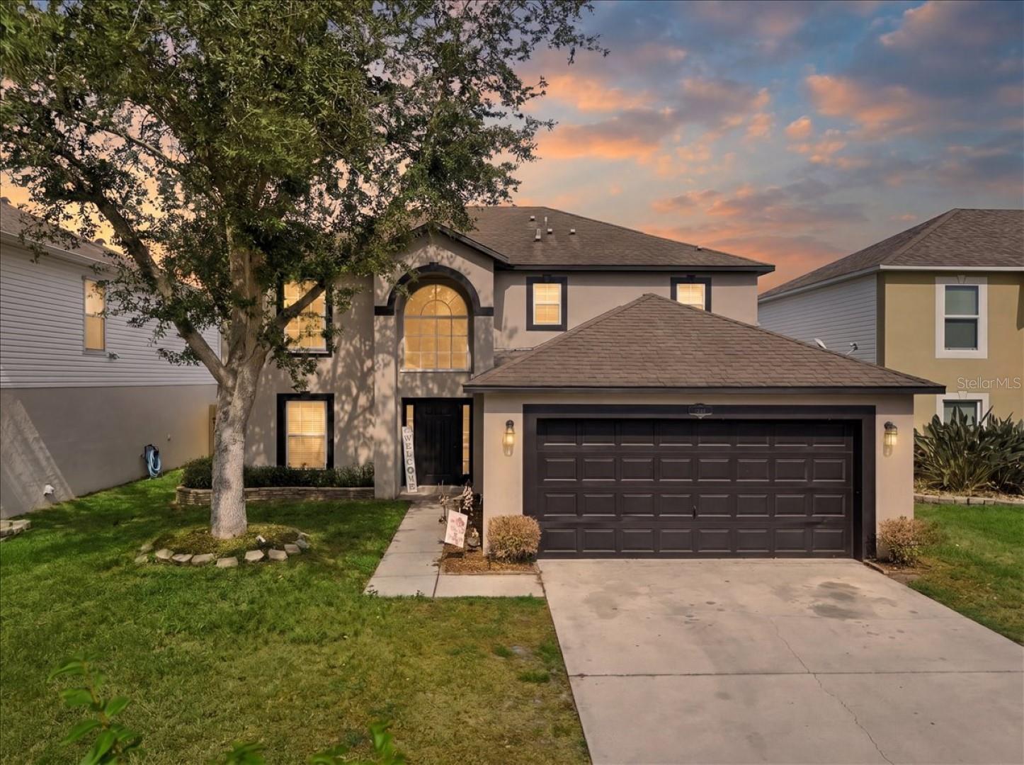 Tucked behind a secure, gated HOA entrance, this beautifully maintained two-story home offers space & serene preserve views. With four spacious bedrooms, two full baths, and a convenient half bath, the layout is designed for both everyday comfort and easy entertaining. Architectural details like graceful archways and dining area create an inviting flow, while track lighting adds a modern touch. Kitchen is both functional and stylish, featuring a large island & generous walk in pantry. French doors lead to an expansive screened porch. Upstairs, primary suite provides a relaxing retreat with a soaking tub & sep shower. The additional bedrooms offer flexibility for family, guests, or a home office. Step outside to the oversized screened porch and unwind with the peaceful views of the preserved area.
