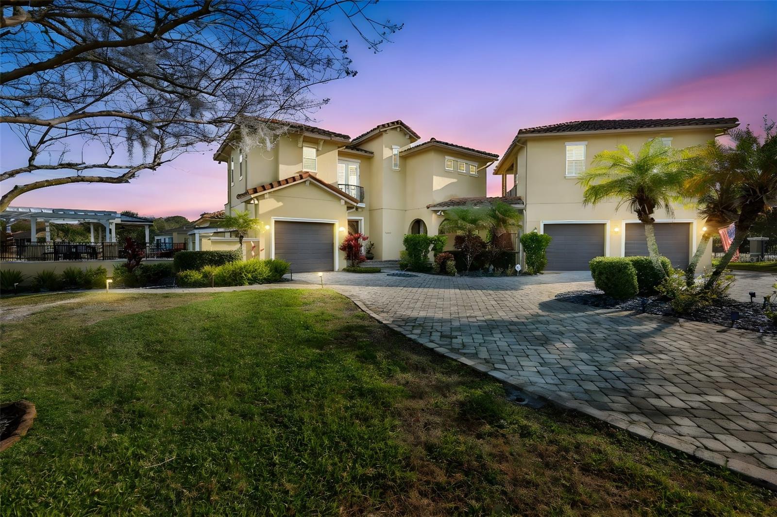 Wake up to peace, privacy and breath taking lake views on this 1.42 acre waterfront retreat in beautiful Odessa. Set behind a private gated entry, this home in anything but cookie cutter offering space, flexibility, and a true resort style lifestyle. 
Inside, soaring tray and coffered ceilings, acacia wood floors, wood beams, and granite countertops create a cozy and elegant feeling. The oversize kitchen island, gas stove, stainless appliances and expansive sliding glass doors make entertainment effortless, opening to multiple patios, a pergola, fire pit and a gas heated saltwater pool and spa overlooking the serene lake. New Bosch AC unit installed in 2025 and new duct work done in attic along with adding air purification and dehumidifier in 2026 to keep home cool and comfortable year around. Upstairs there is an additional bonus space, a craft room, and indoor access mother in law quarters with a private bath along with lake view from screened patios.  
This home is unique because it also has a separate mother-in-law quarters above the oversized garage, featuring a private entrance, full bath, kitchenette, and separate a/c. Ideal for multigenerational living or guests. Home also has eco friendly bug misting system around exterior of home.