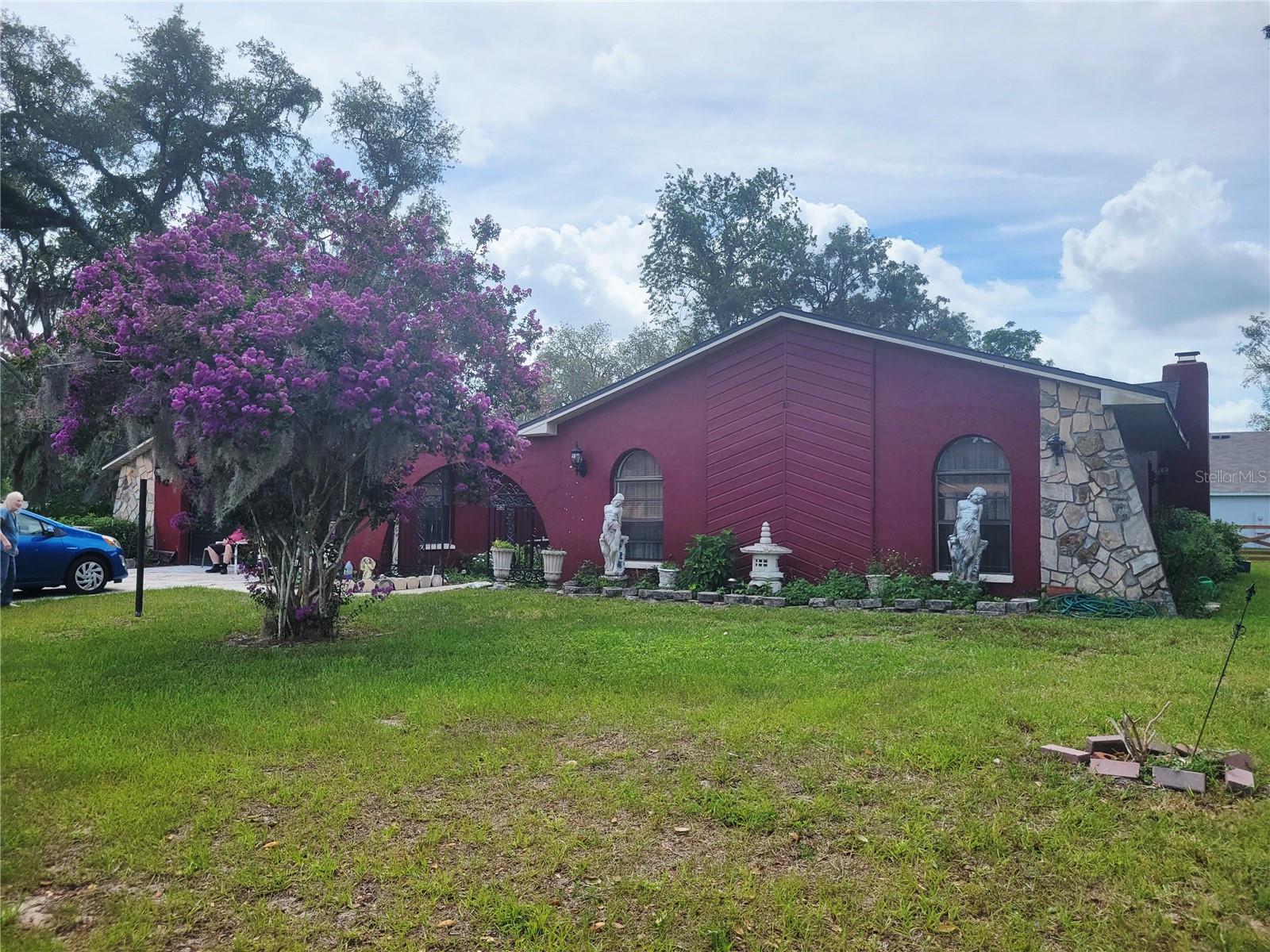 Sitting on a corner lot of .40 acres is this single Family Home featuring 3 Bedrooms 2 Baths and a 2 Car garage with a Gunite inground pool.  2478 sq ft of living and 3659 sq ft total under roof. Fresh interior paint in all rooms except the bedrooms. Home features spacious Entry Living Room and Foyer. Split floor plan. The Family Room features a stoned woodburning fireplace with kitchen, breakfast bar and dining area. Off of the family room is a Dry Bar area. Sliders from the Family Room lead to your inground pool and covered lanai. This home has good bones but needs your finishing touches and some TLC. Master is handicap accessible with French door entry. Message us today for your private showing