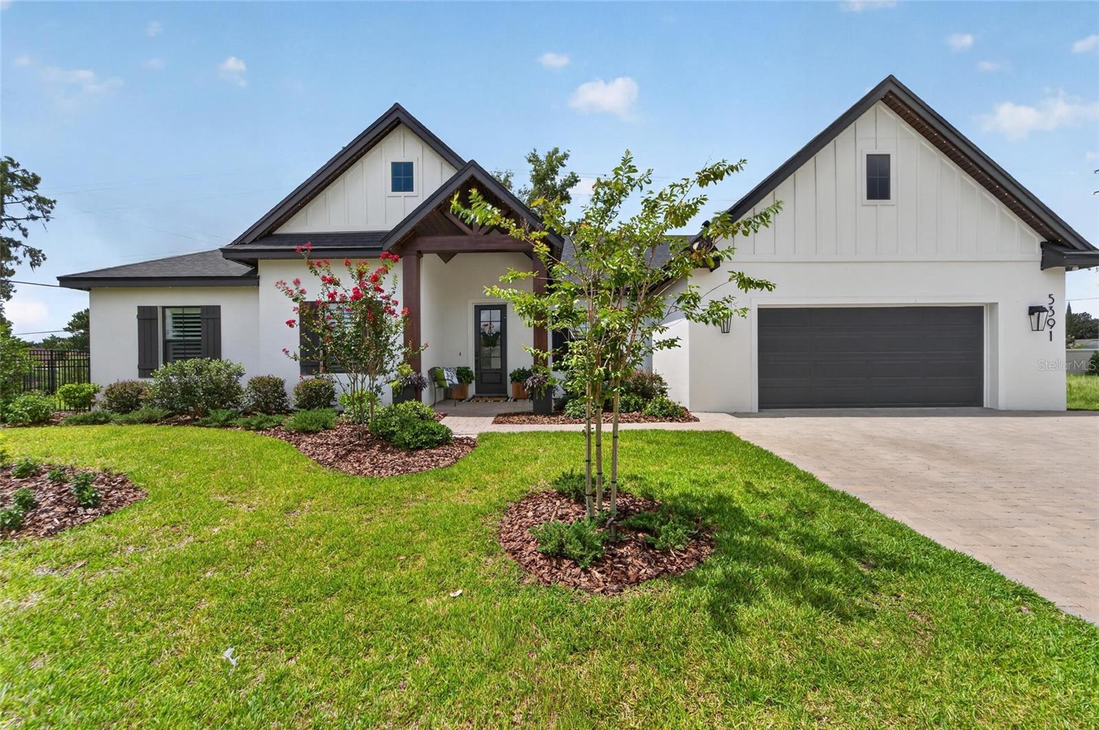 Welcome to 5391 Clubhouse Hills Lane, an exceptional 2025 Hulbert Homes custom residence located in the gated community of Clubhouse Hills Estates in desirable South Lakeland. Offering 3 bedrooms, 2 bathrooms, and 2,133 square feet, this move-in ready home combines quality craftsmanship with luxury finishes and premium upgrades that would cost thousands to add after closing.

Step inside to discover soaring ceilings, an open floor plan, and an abundance of natural light. The gourmet kitchen features quartz countertops, custom wood cabinetry, premium appliances, a large center island, and an oversized walk-in pantry. The spacious great room and dining area flow seamlessly together, making this home perfect for entertaining or everyday living.

The private primary suite offers a relaxing retreat with a spa-inspired bathroom featuring dual vanities, a large walk-in shower, and a spacious walk-in closet. Plantation shutters throughout the home provide timeless style, privacy, and energy efficiency.

The outdoor living space is just as impressive. Enjoy the covered lanai with a motorized screen enclosure, allowing you to enjoy Florida's beautiful weather with the touch of a button. The fully fenced backyard offers privacy, space for pets, and plenty of room to add a future pool.

This home is loaded with upgrades including Gemstone permanent architectural and holiday lighting, professional landscape lighting, a whole house water softener system, surround sound and AV upgrades, a custom Closets by Design garage storage system, plantation shutters throughout, a motorized screened lanai, and a fully fenced backyard.

Clubhouse Hills Estates is one of South Lakeland's newest gated communities and is conveniently located near shopping, restaurants, medical facilities, top-rated schools, Lakeside Village, downtown Lakeland, and the Polk Parkway for an easy commute to Tampa and Orlando.

Why wait months to build when you can own a completed Hulbert Homes custom home with thousands of dollars in upgrades already finished? This beautifully designed home offers luxury, convenience, and peace of mind in one of South Lakeland's most desirable new communities.