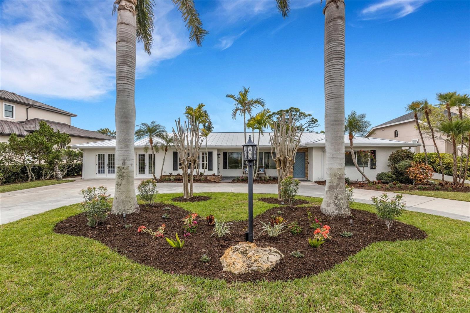 Welcome to Bayshore...This move-in-ready home blends thoughtful upgrades, flexible living, and an unbeatable location—offering the very best of Florida coastal living- a rare opportunity to own in one of Venice Island's most sought after spots- where luxury, location and lifestyle meet.

This exceptional coastal retreat on prestigious Bayshore Drive on Venice Island.  Perfectly positioned just across the street from the Intracoastal Waterway, this one level, zero-entry, 5 bedroom, 5 bath home captures serene water views and refreshing breezes. A perfect blend of coastal charm with modern upgrades in this beautifully renovated home, ideally located just 0.6 miles from the beach, Freedom Boat Club and public boat ramp. Enjoy waterfront views from the living room and porch. Take a short bike ride to the Venice Yacht Club, historic downtown, parks, shops, restaurants, and performing arts theater.

At the heart of the home is a gorgeous chef’s kitchen featuring a stunning 10' island, quartz countertops, custom tile backsplash, and new Forno appliances including a refrigerator, dishwasher, microwave drawer, and induction range—perfect for both entertaining and everyday living. The thoughtfully designed layout offers two master suites, providing exceptional comfort and privacy for owners and guests.

This home has been extensively updated with attention to both style and function, including a new metal roof (2026) with warranty, freshly painted interior and exterior, and a circular drive for added convenience and curb appeal. Interior upgrades include custom shiplap, French doors, recessed lighting, crown molding, new ceiling fans throughout, Butler's pantry with ample storage, along with new vanities, fixtures, faucets, and custom ceramic tile in the bathrooms. Additional features include new locks and smart thermostats for modern living.

Step outside to your private Florida oasis with a resurfaced pool (2016), new screened lanai (2025), and new pool pump (2025). The expansive backyard offers endless possibilities—perfect for pets, a playground, gardening, or enjoying natural wildlife. The property also features new sod and irrigation on the side and rear, plus irrigation and lighting in the front yard, and fresh landscaping with birds of paradise, a mango tree, and milkweed to attract butterflies.

Additional upgrades include a Culligan water softener (2023) and a new 50-gallon water heater with booster pump for on-demand hot water, plus Maytag washer and dryer (2023).

This stunning home blends thoughtful upgrades, flexible living, and an unbeatable location—offering the very best of Florida coastal living- a rare opportunity to own in one of Venice Island's most sought after spots- where luxury, location and lifestyle meet.